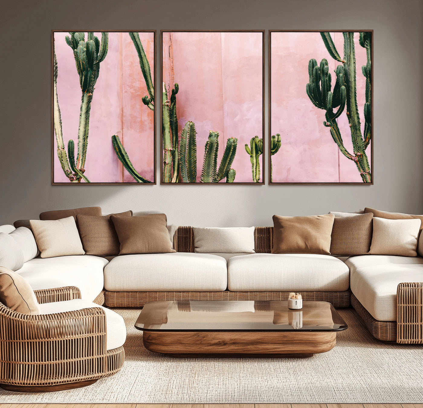 Framed canvas of tall green cacti against a soft pink wall, ideal for modern desert or colorful southwest-inspired home decor.