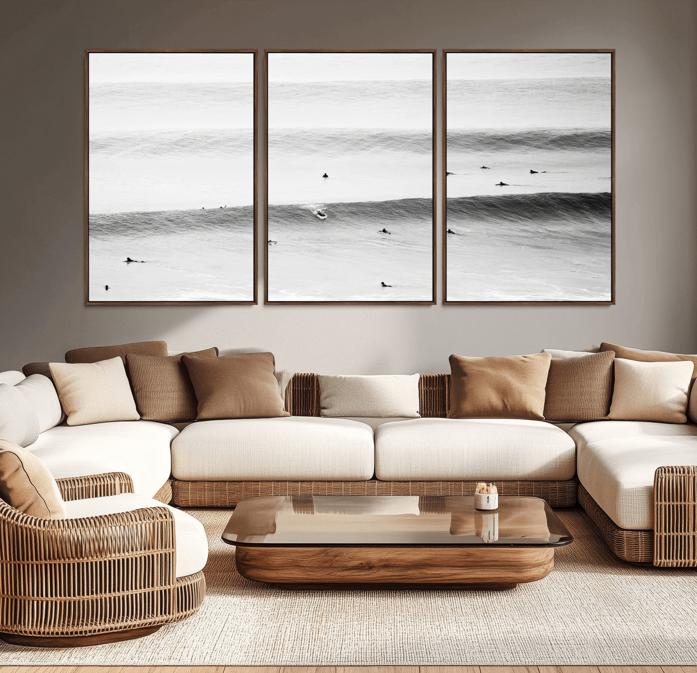 A monochrome photograph of swimmers gliding through gentle ocean waves, evoking a sense of calm and movement.