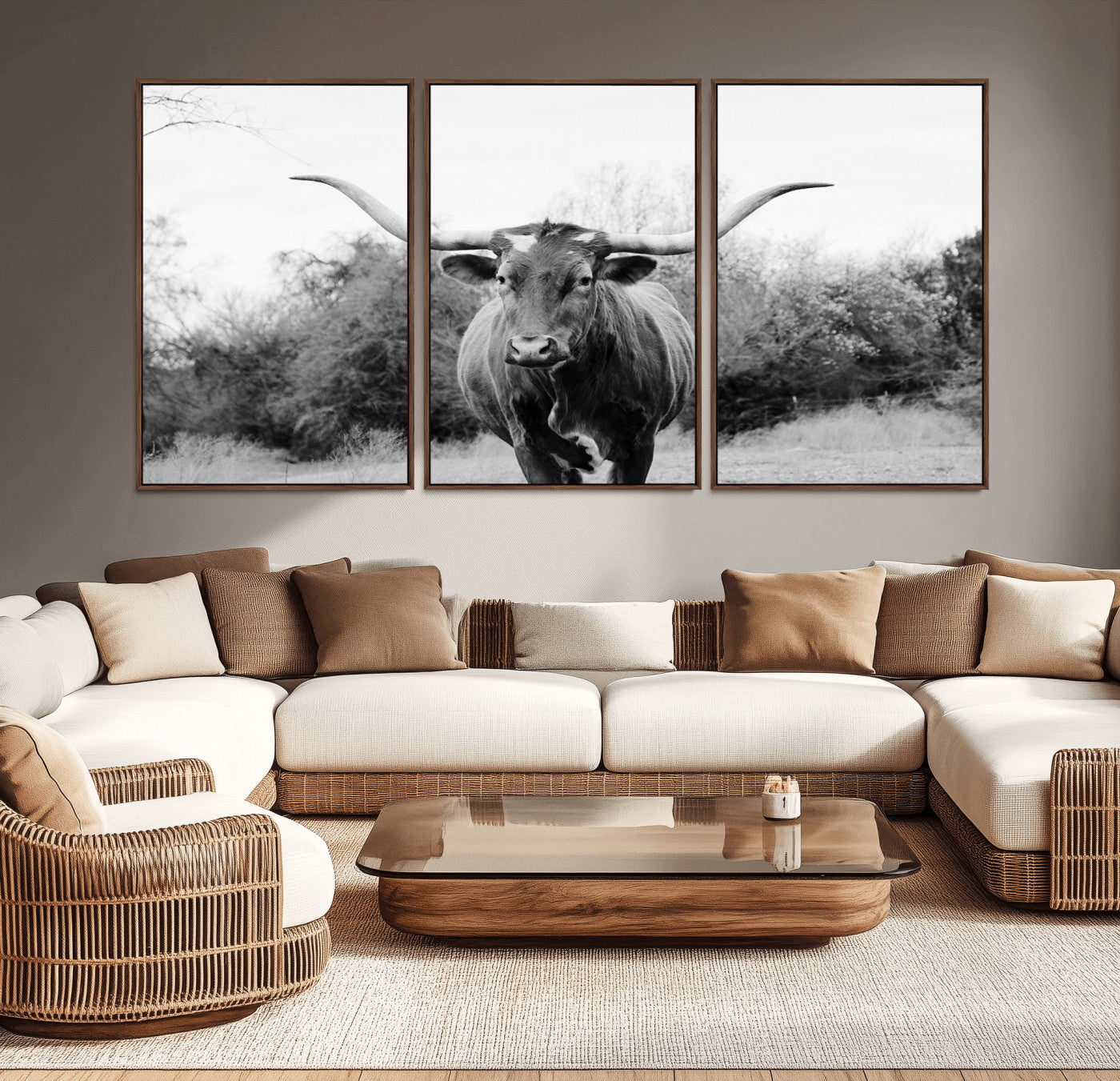 Black and white photo of a longhorn cow in a field, perfect for rustic farmhouse or western-themed interior wall decoration.