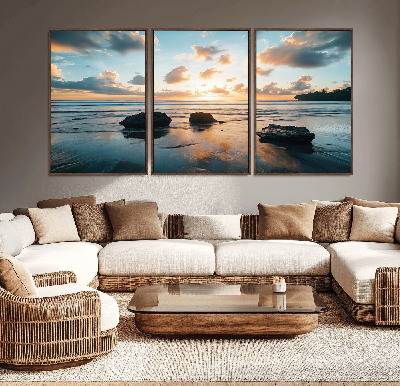 A serene beach at sunset with vibrant clouds, calm water, and rocks in the foreground reflecting the warm colors of the setting sun.