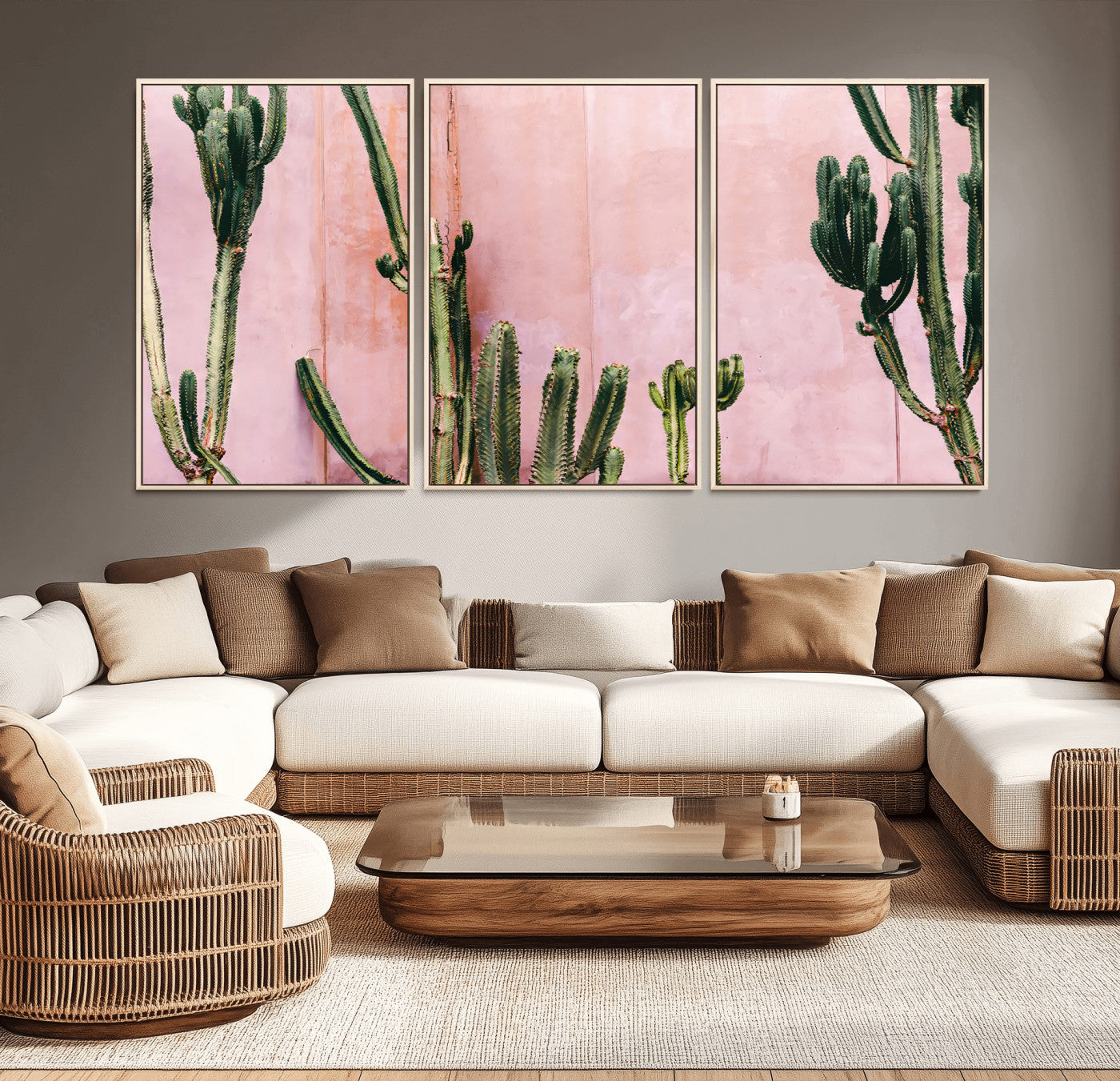 Framed canvas of tall green cacti against a soft pink wall, ideal for modern desert or colorful southwest-inspired home decor.