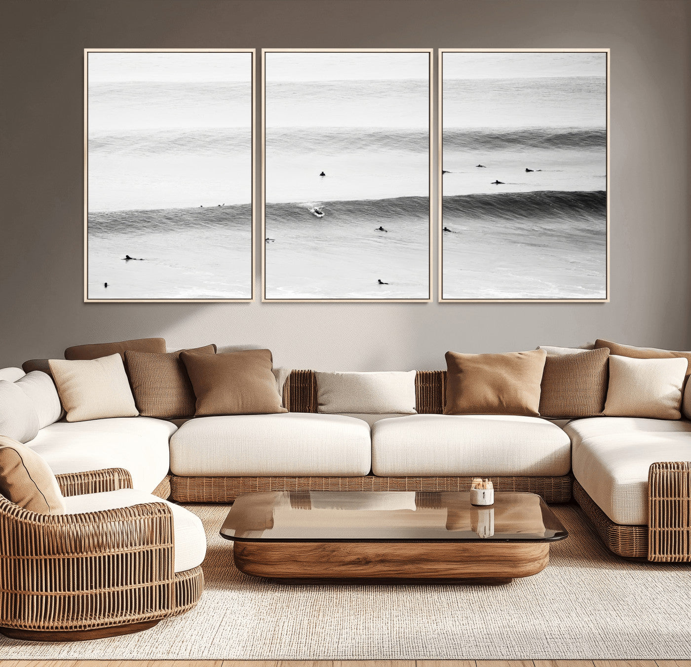 A monochrome photograph of swimmers gliding through gentle ocean waves, evoking a sense of calm and movement.
