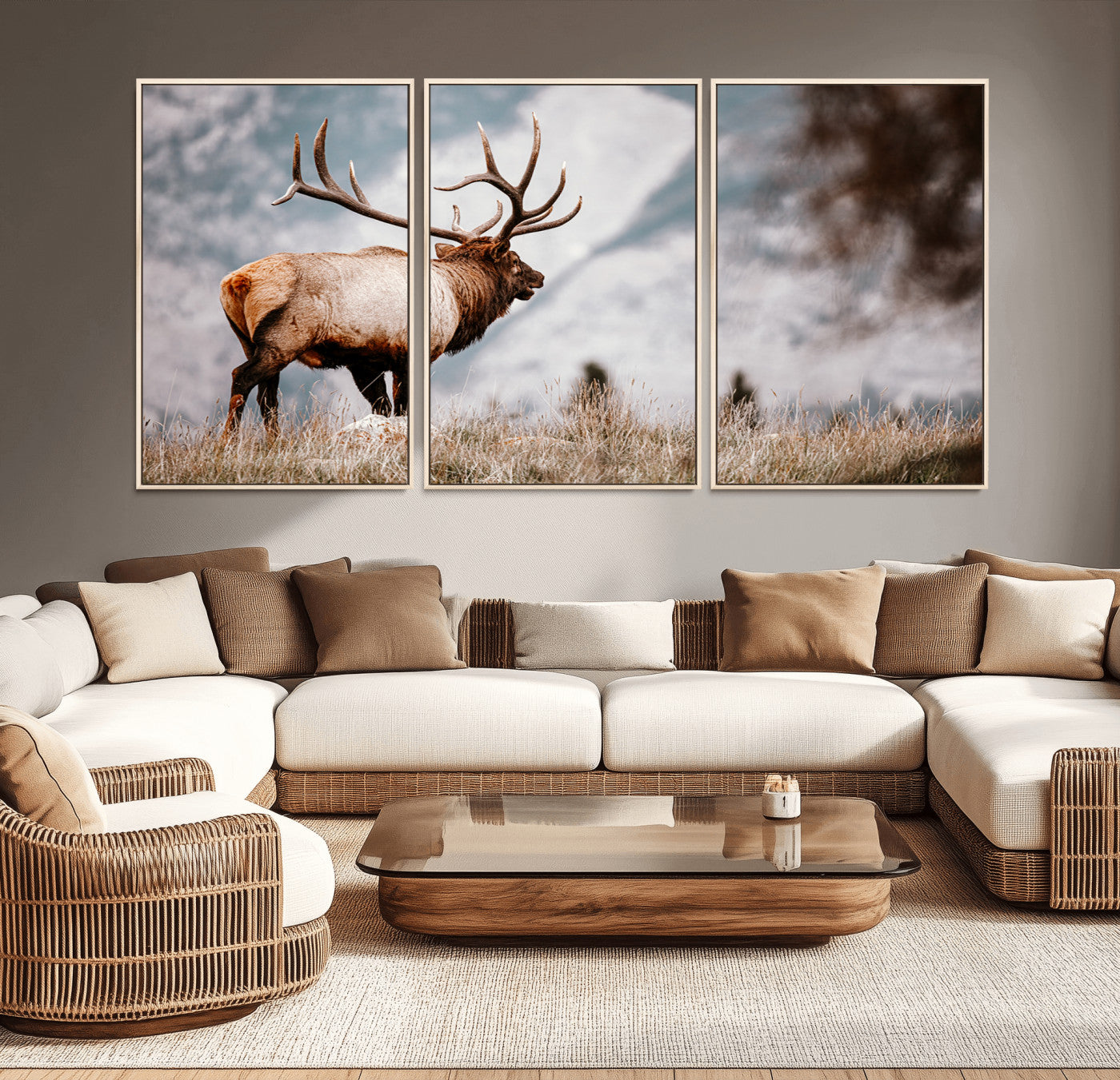 Majestic elk with large antlers standing in grass with snowy mountains in background, perfect for rustic cabin or lodge style decor.