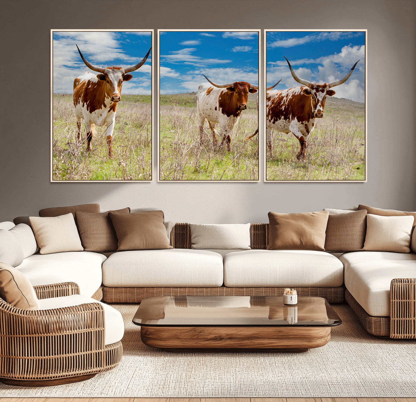 Three Texas longhorn cattle standing in dry grass under a bright blue sky, ideal for farmhouse or western rustic home decor.