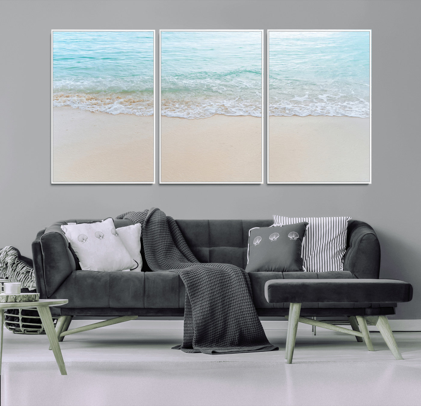 Soft shoreline with gentle aqua waves on smooth sand, ideal for minimalist coastal or pastel ocean-inspired home wall decor.