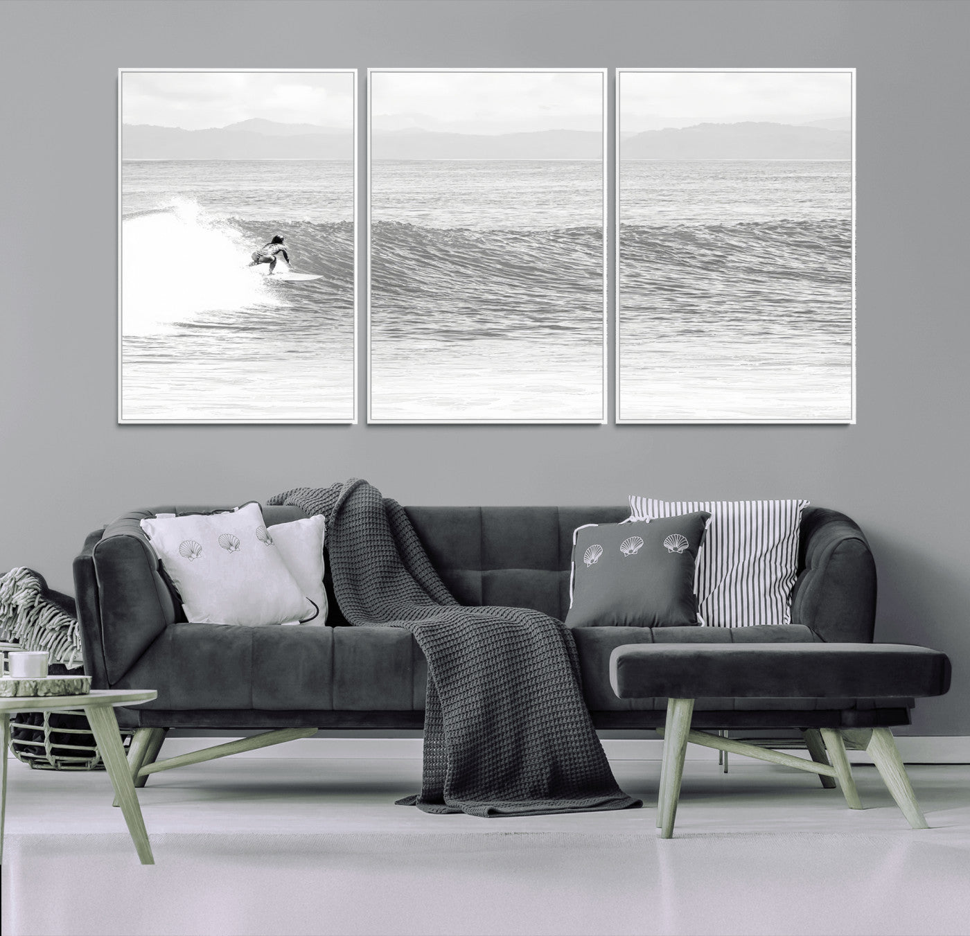 Monochrome photo of a surfer riding a wave with distant mountains, ideal for coastal motion or black and white surf-themed wall decor.