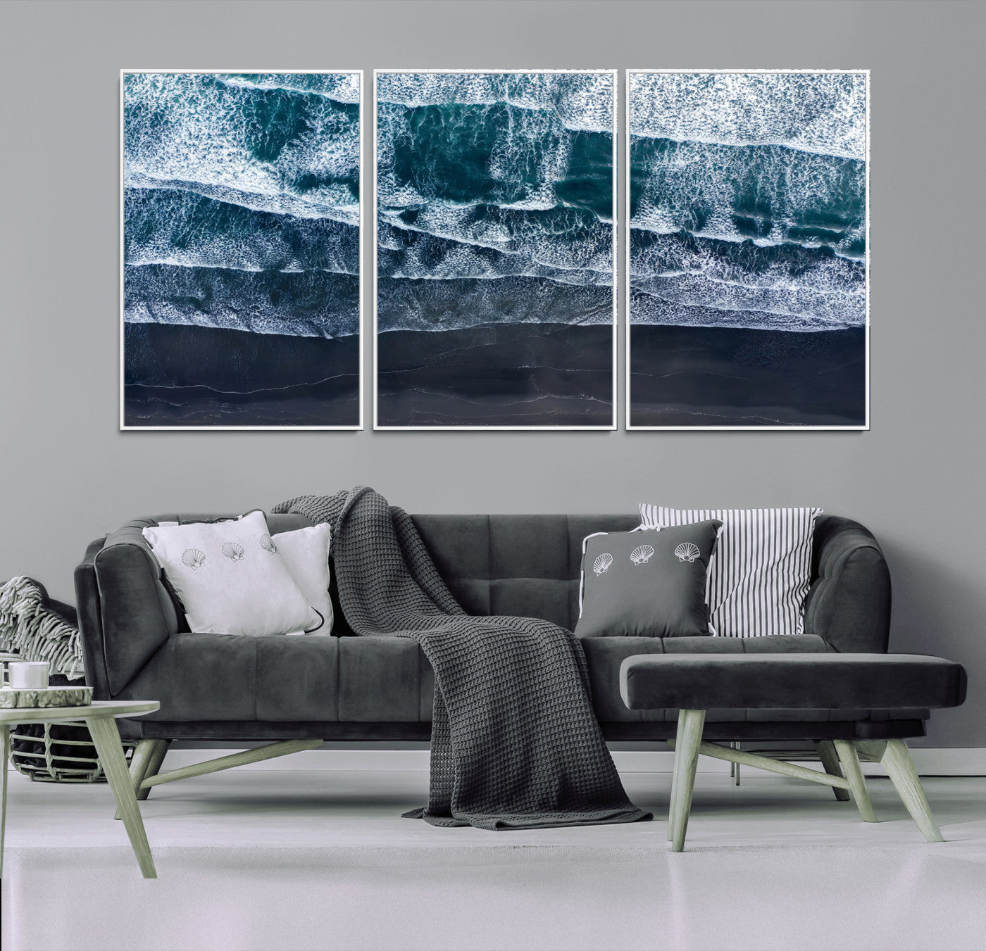 Canvas of aerial ocean waves crashing onto a black sand beach in moody tones, ideal for modern coastal or minimalist home decor.
