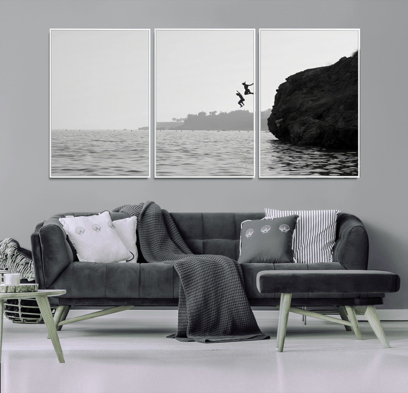 Black and white canvas of two figures cliff jumping into the sea, captured with moody tones, ideal for modern coastal or adventure-themed home decor. 2/2