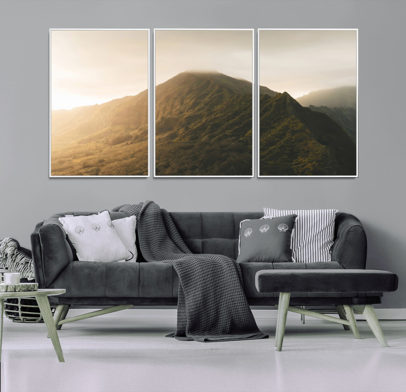 Sunlit mountain peak with mist rolling over its rugged slopes, bathed in golden light, creating a warm and tranquil nature-inspired scene.