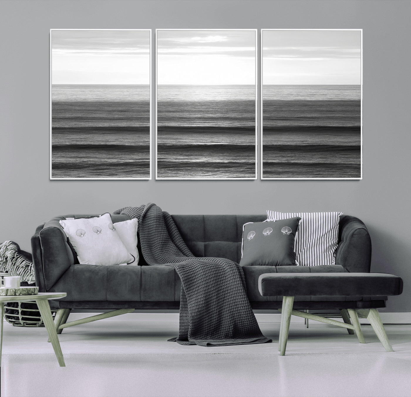 Minimalist black and white ocean view with layered waves reflecting sunlight, evoking a sense of calm and coastal serenity.