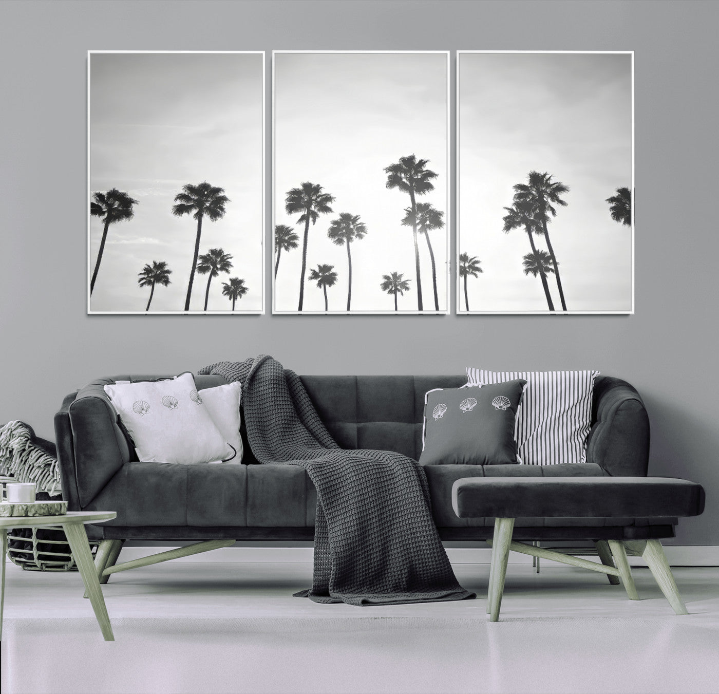 A black and white minimalist scene featuring tall palm trees silhouetted against a bright sky, creating a dreamy and timeless tropical aesthetic.