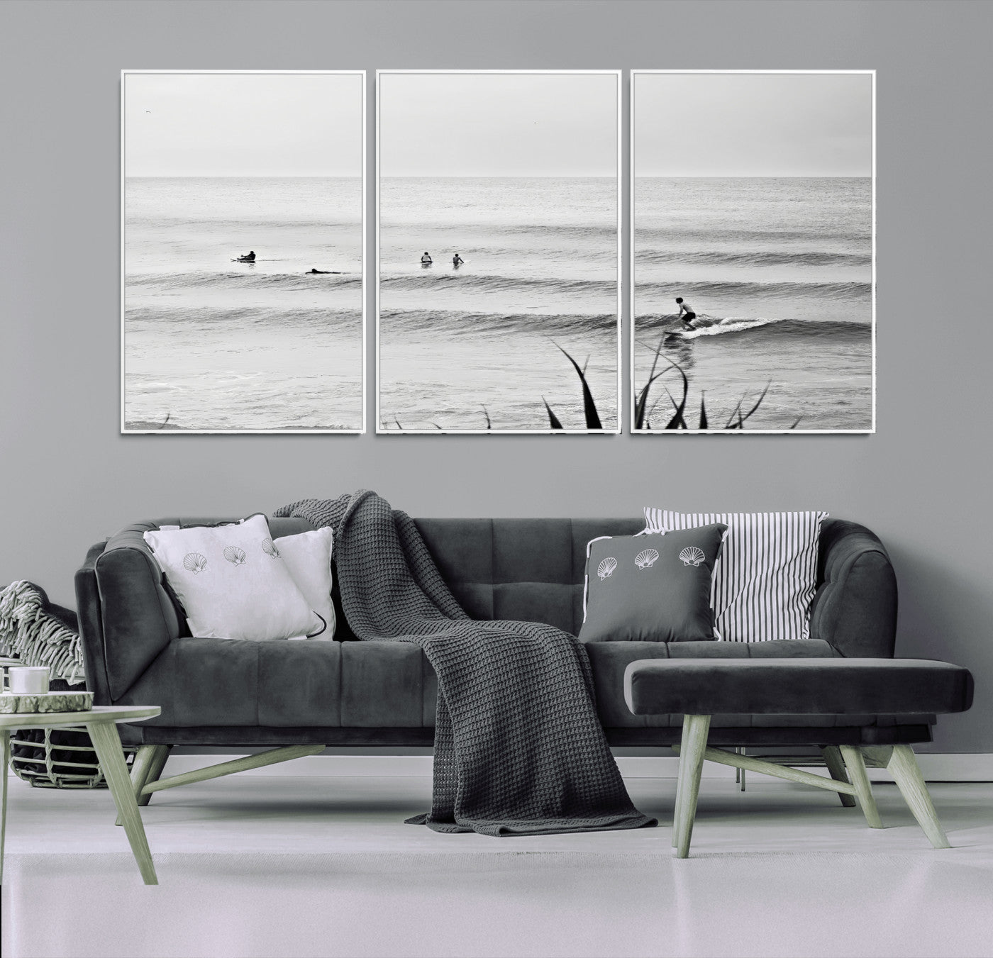 Monochrome canvas of surfers on calm ocean waves, ideal for minimalist coastal or beach-inspired interior decor.