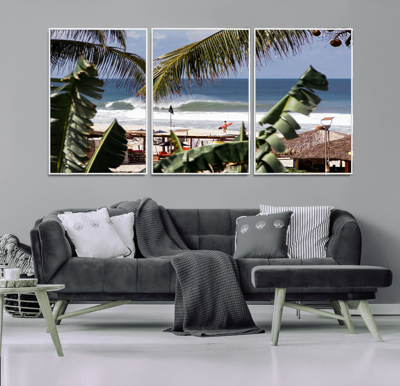 Canvas wall art of a tropical surf scene framed by palm trees, with a surfer on the shore and waves rolling in, ideal for beach-themed decor.