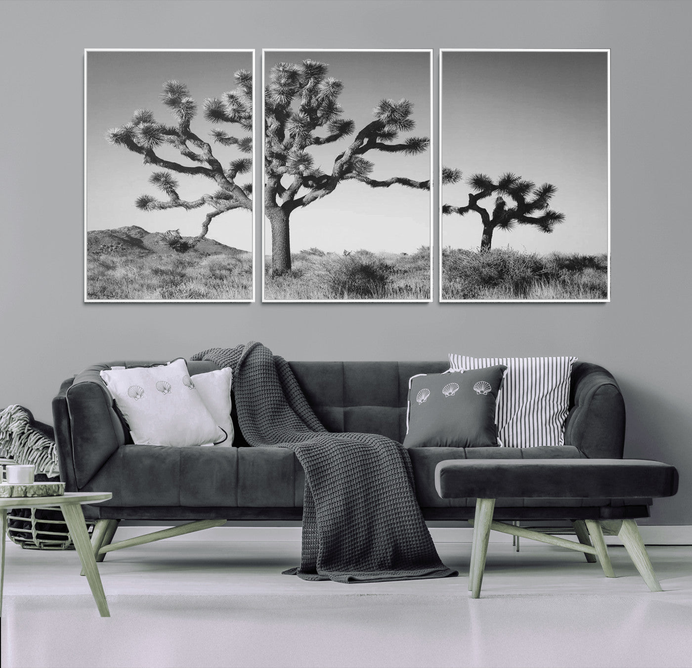 Black and white Joshua trees in a rugged desert landscape, creating a calm and minimalist feel for natural or rustic-themed interiors.