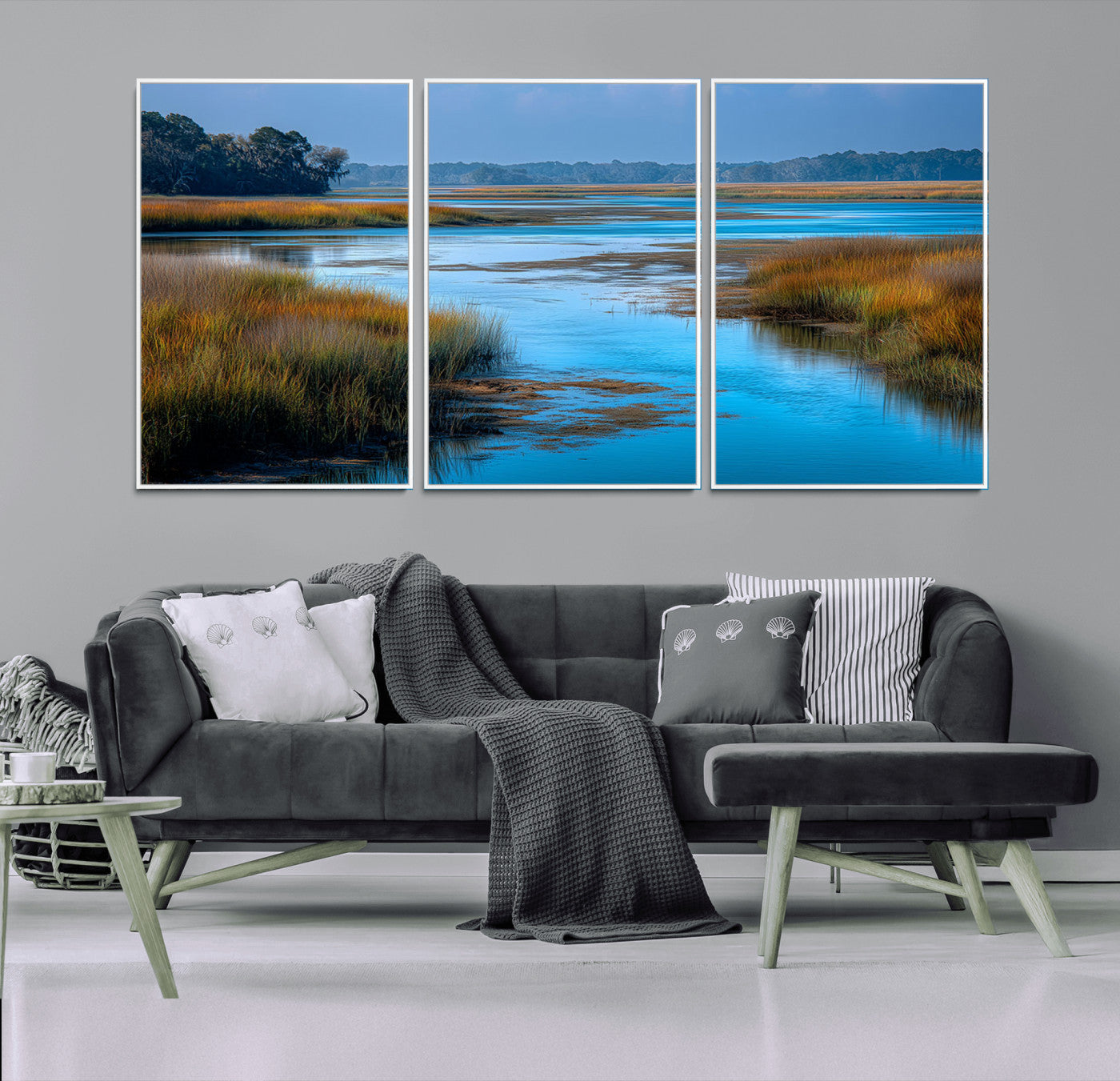 A peaceful marshland scene with calm blue water reflecting the surrounding grasses and trees, capturing the beauty of nature in a serene landscape.