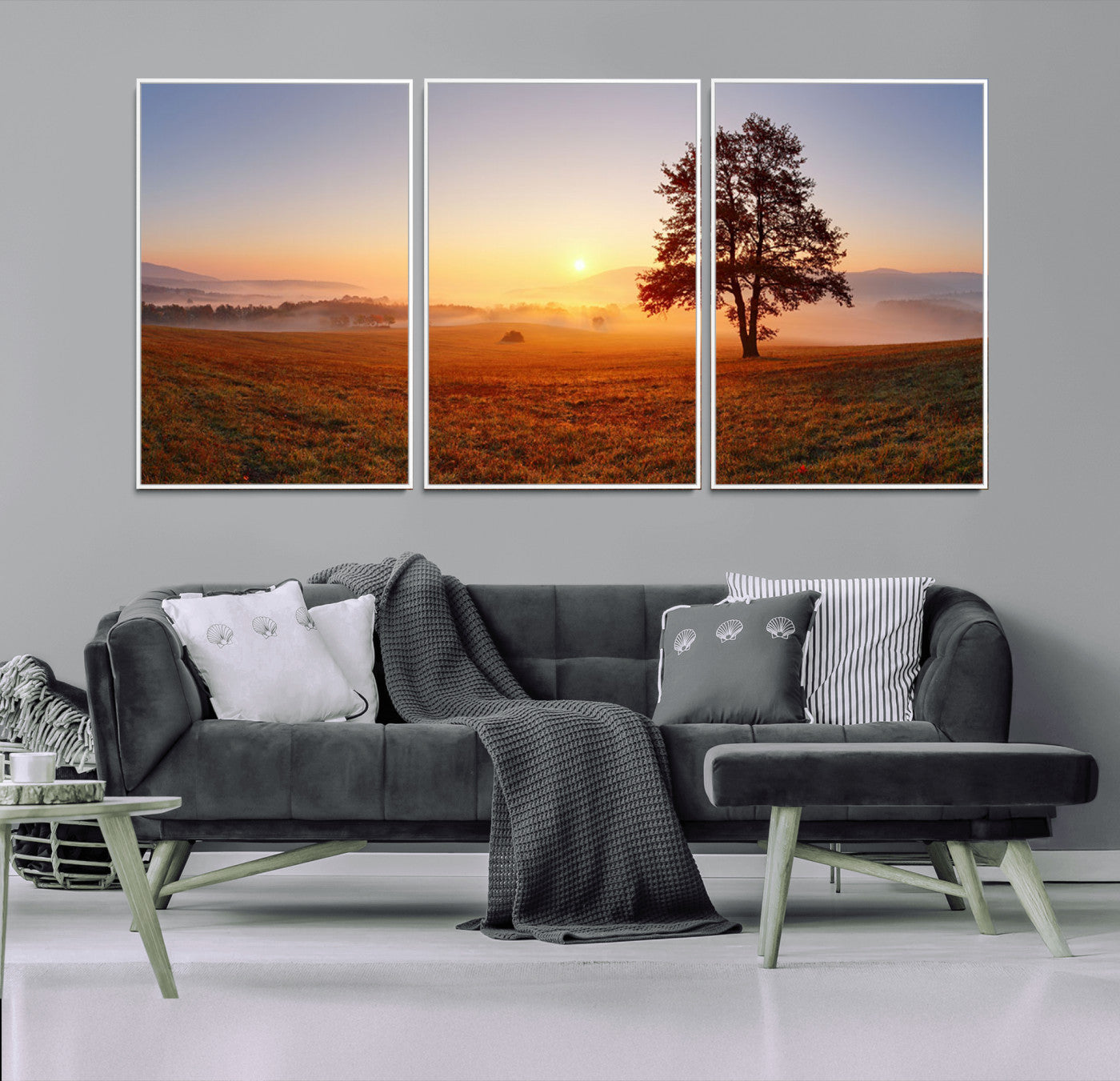 A tranquil landscape at sunrise with a mist-covered field and a lone tree, creating a peaceful and natural atmosphere.