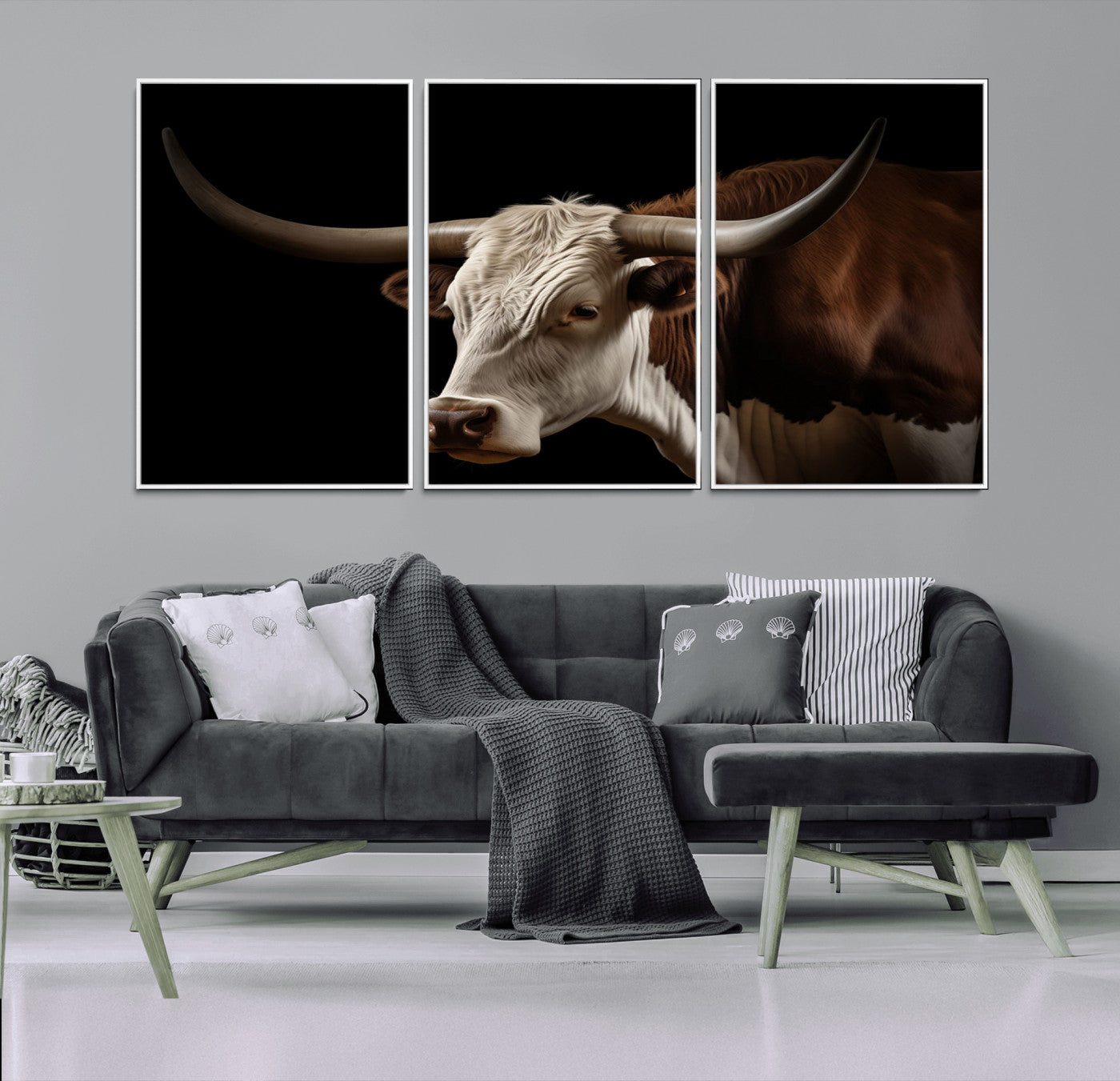 "Close-up of a brown and white longhorn cow with prominent curved horns against a black background."