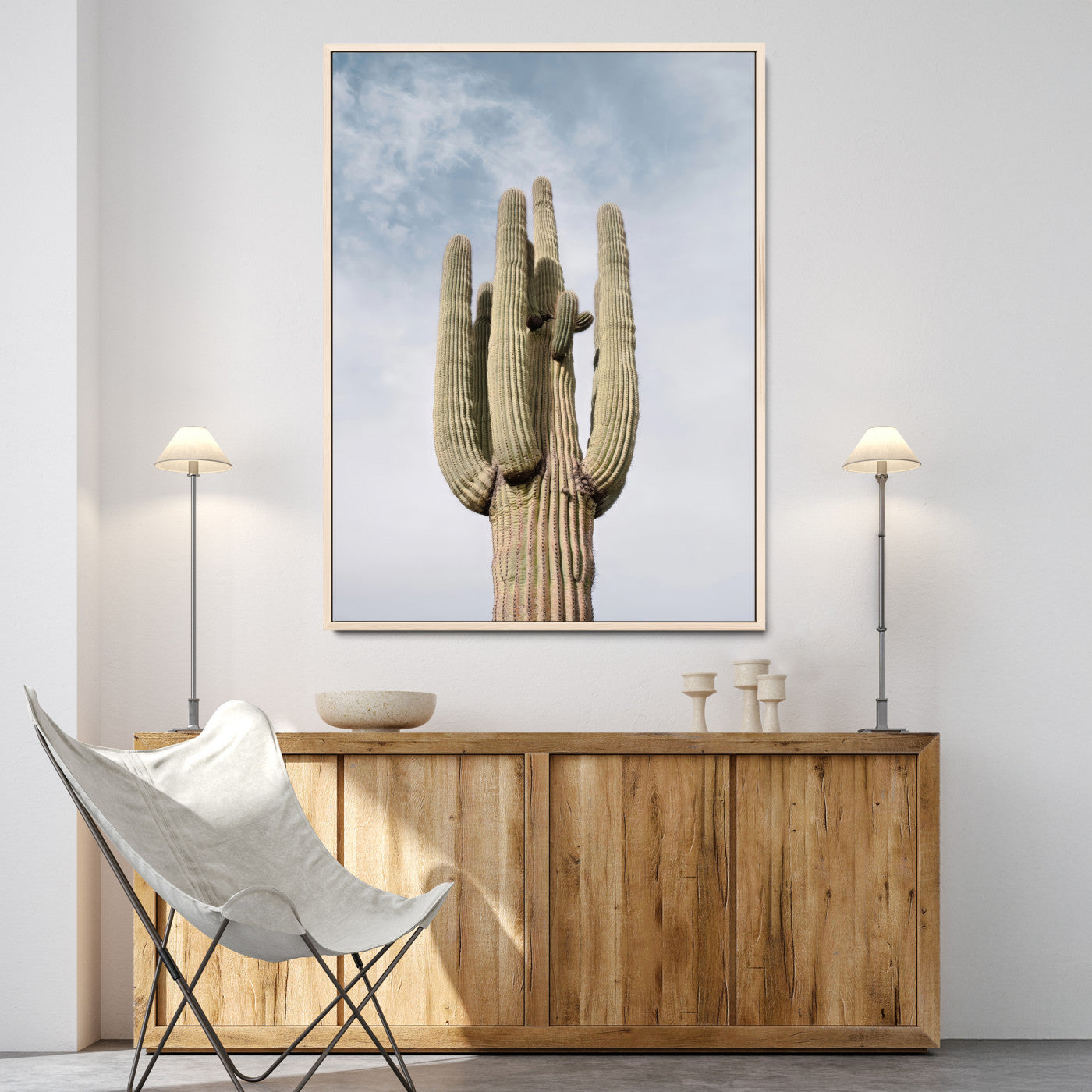 Vertical photo of a tall saguaro cactus against a soft sky, ideal for earthy or Southwestern home decor with warm neutral tones.