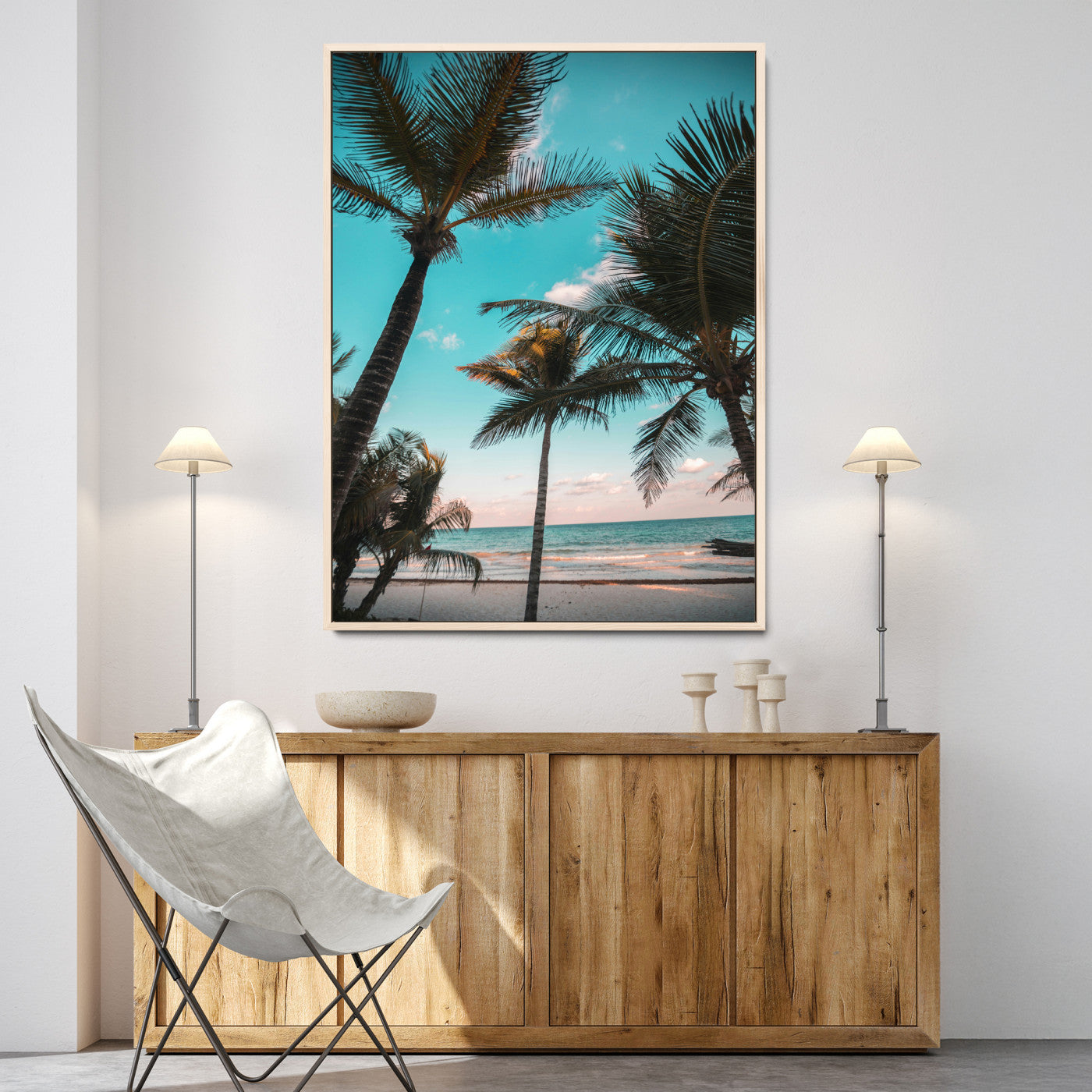 Tall palm trees swaying over a tropical beach with turquoise ocean waves and a soft sunset glow, creating a relaxing coastal vibe.