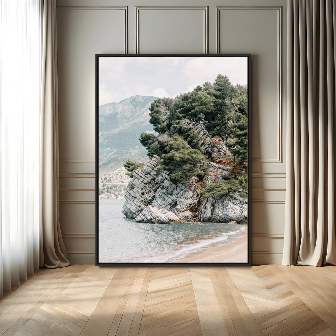 Framed photo of a rocky coastal cliff with dense greenery and calm shoreline, ideal for rustic coastal or earthy-toned home decor.