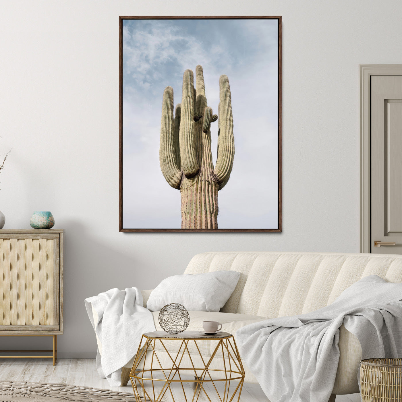 Vertical photo of a tall saguaro cactus against a soft sky, ideal for earthy or Southwestern home decor with warm neutral tones.