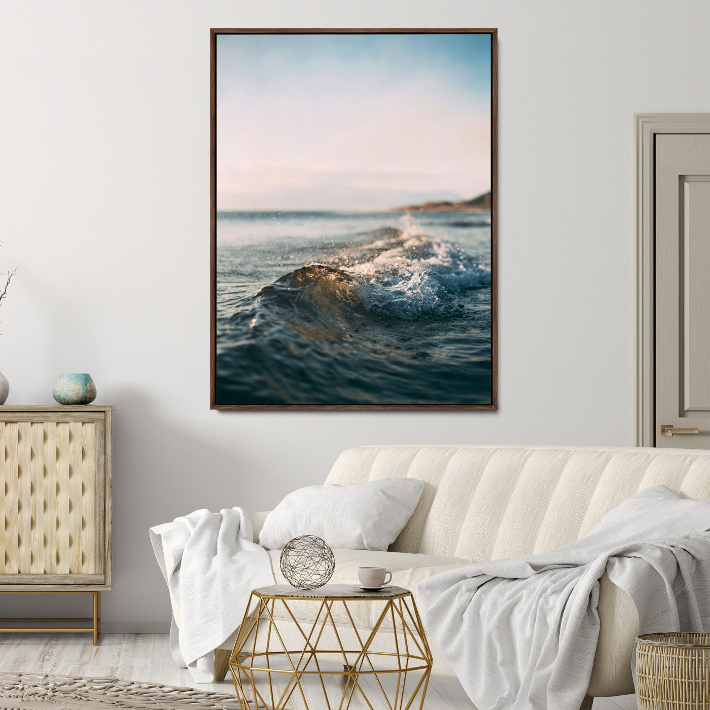 Close-up of ocean waves rolling gently toward the shore at sunset, creating a peaceful and minimalist coastal scene.