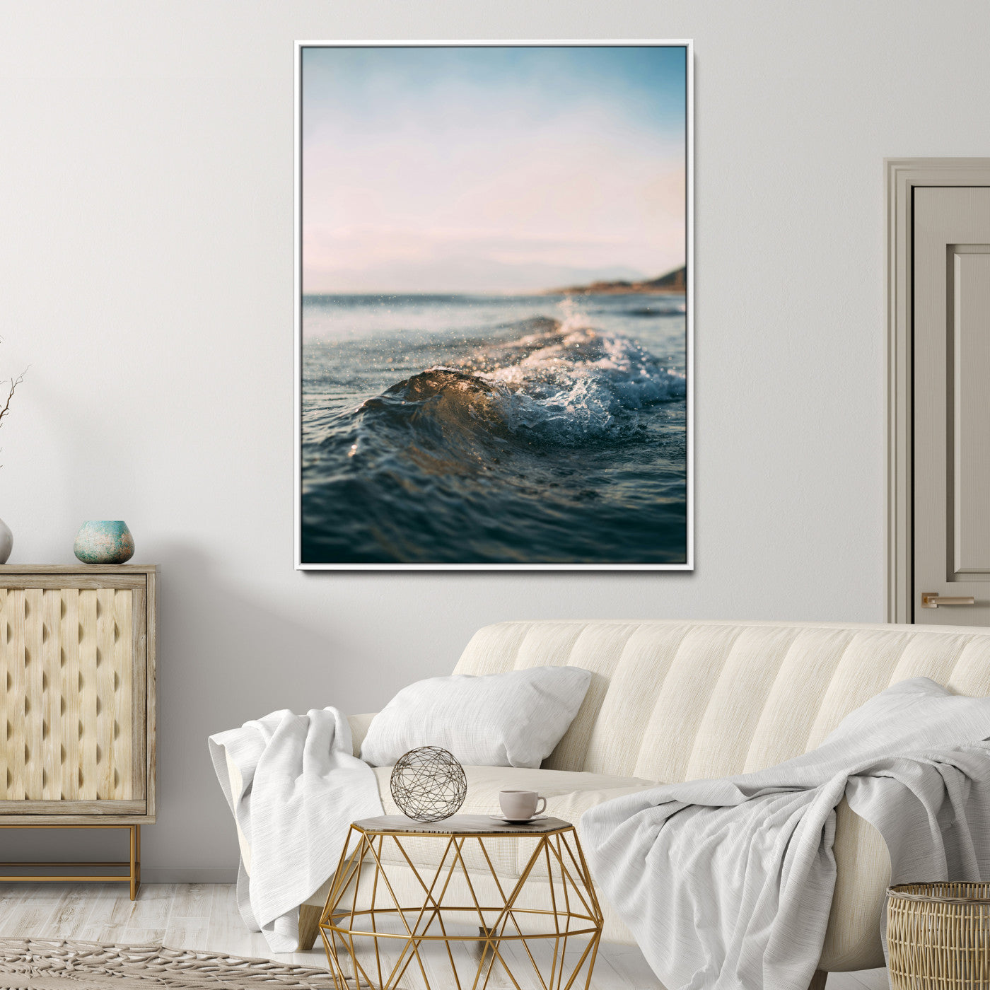 Close-up of ocean waves rolling gently toward the shore at sunset, creating a peaceful and minimalist coastal scene.