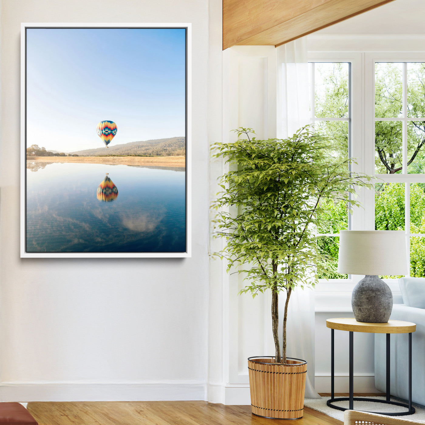 Canvas of a hot air balloon floating above a calm lake with soft reflections and vibrant sky, ideal for modern minimalist or adventure-themed home decor.
