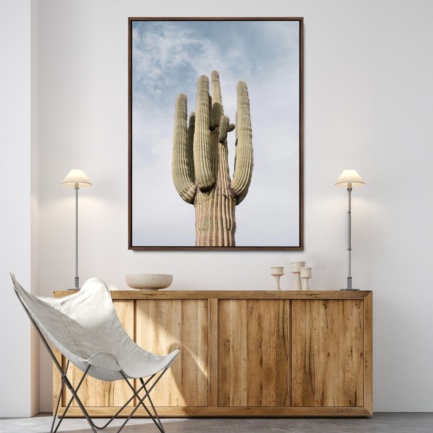 Vertical photo of a tall saguaro cactus against a soft sky, ideal for earthy or Southwestern home decor with warm neutral tones.