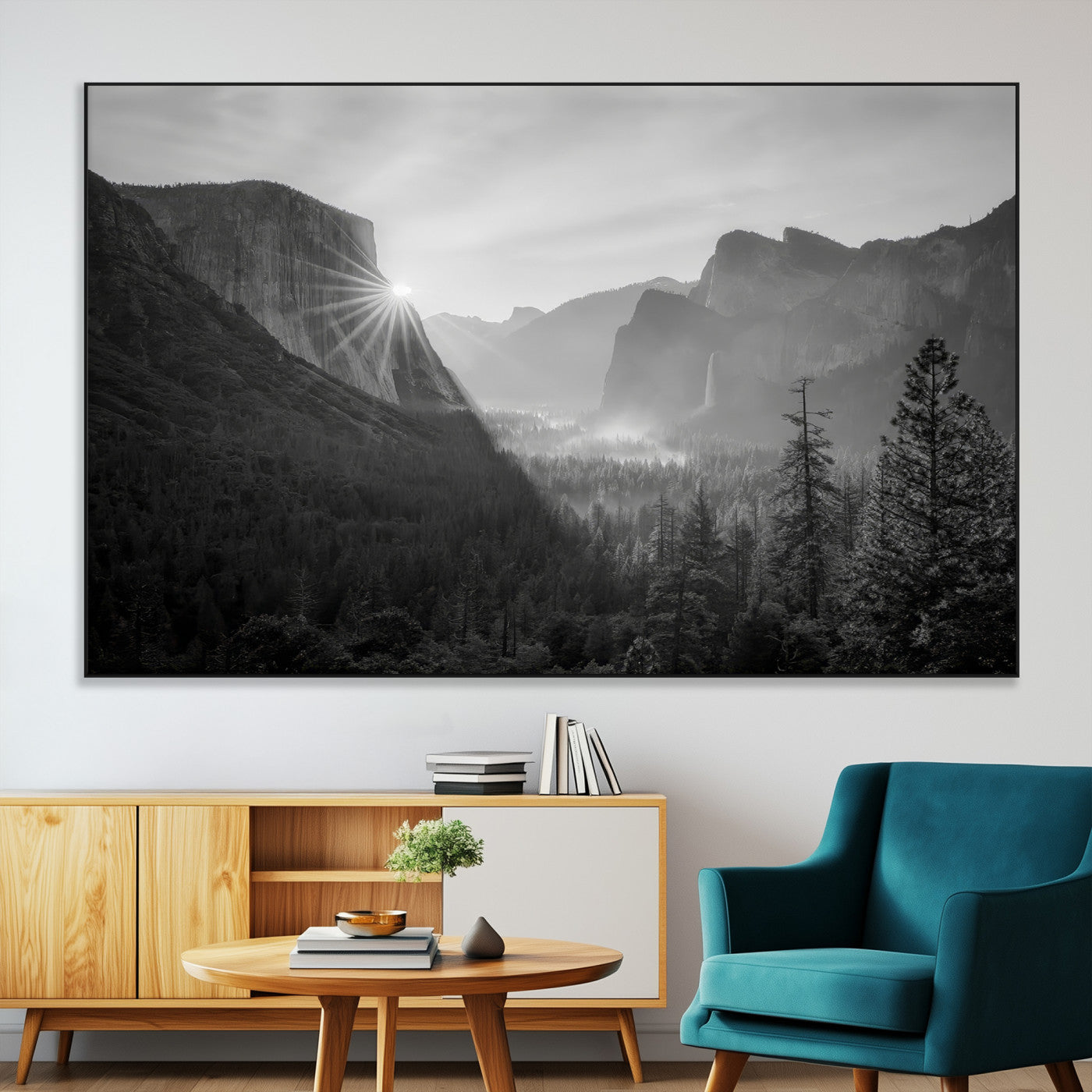 Black and white landscape of Yosemite with sun rays peeking over El Capitan, ideal for moody nature or modern rustic decor.