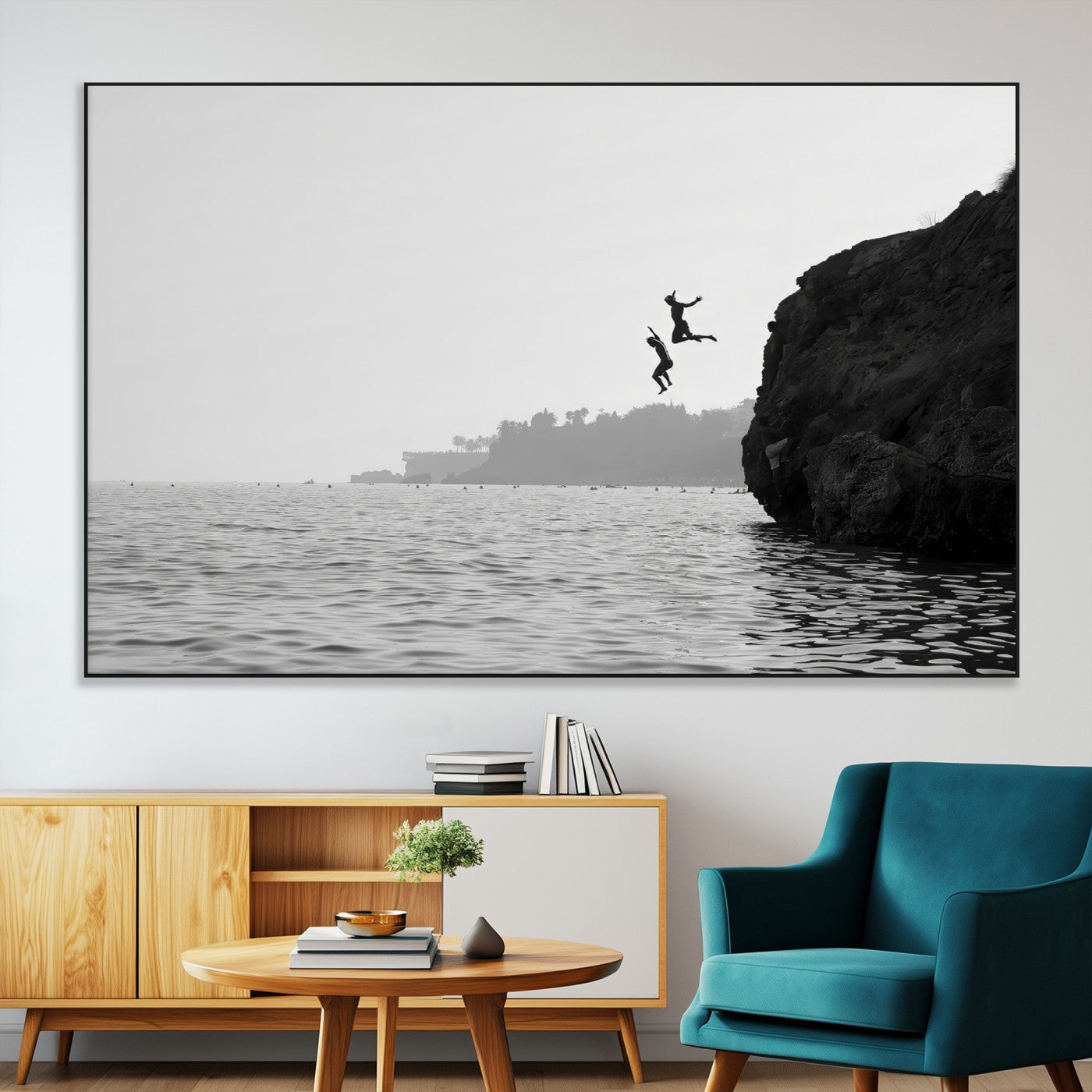 Black and white canvas of two figures cliff jumping into the sea, captured with moody tones, ideal for modern coastal or adventure-themed home decor. 2/2