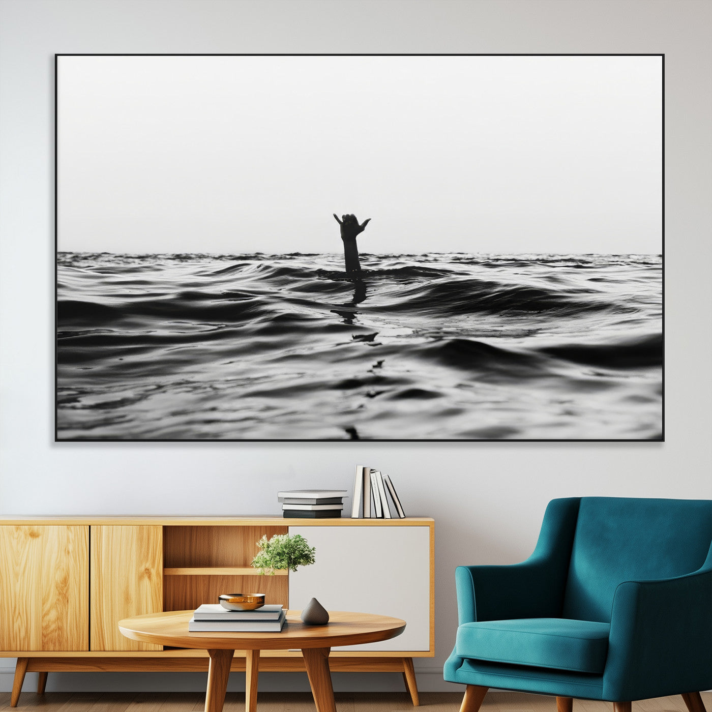 Black and white ocean with a hand making a surfer sign among dark waves, creating a dramatic and minimalist seascape with bold contrast.