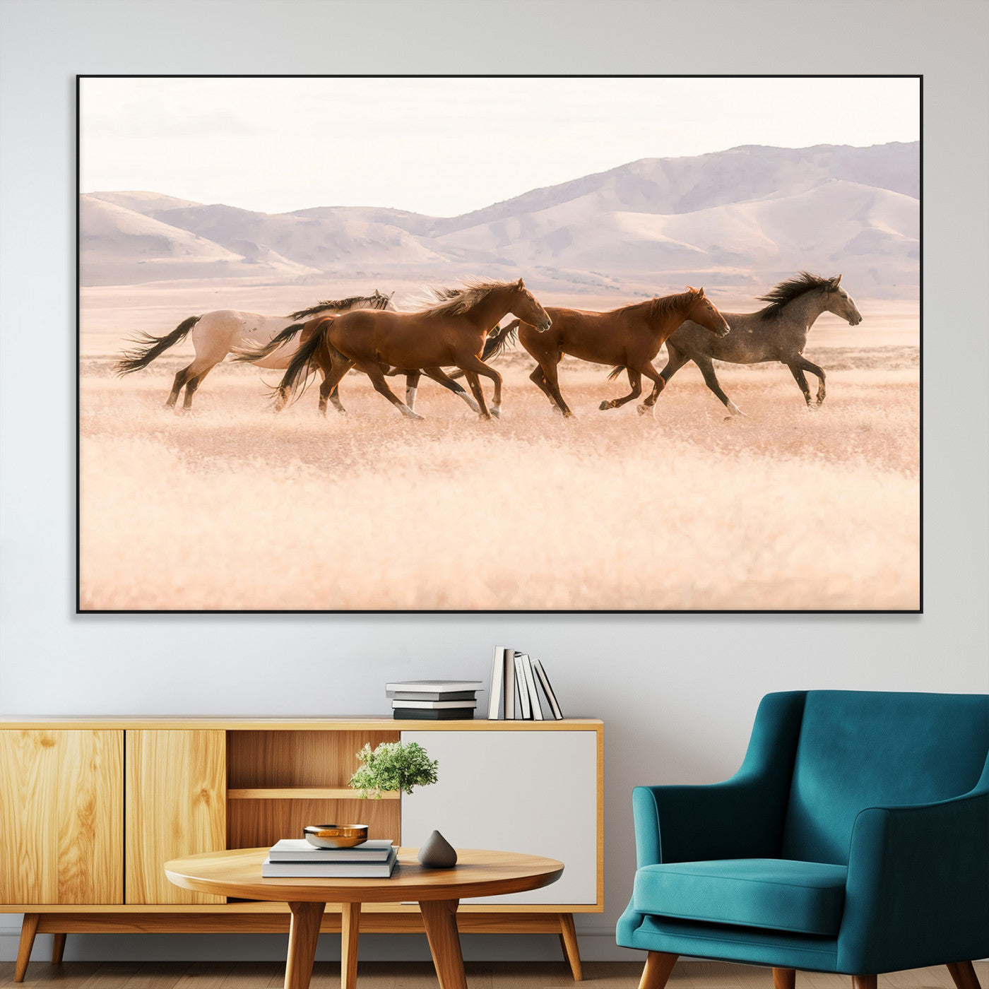 A herd of wild horses galloping through a sunlit desert plain with mountains in the background, perfect for rustic or western-themed wall decor.