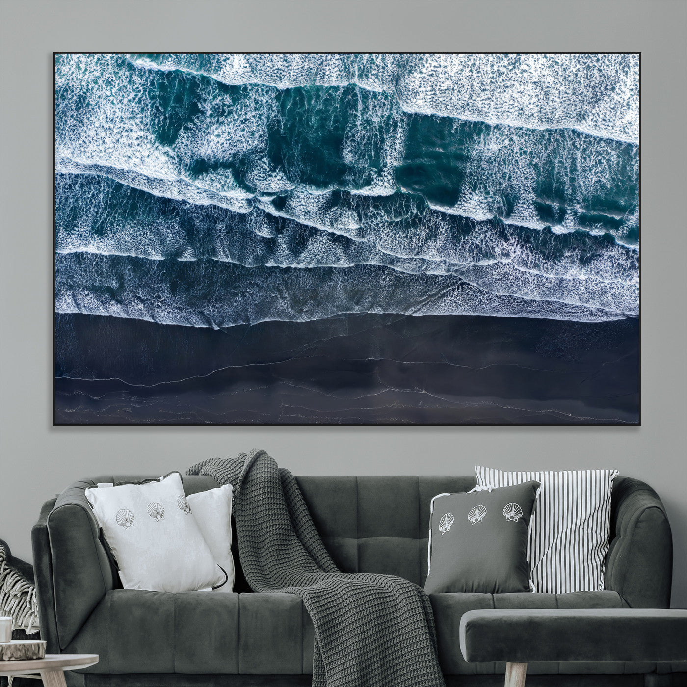 Canvas of aerial ocean waves crashing onto a black sand beach in moody tones, ideal for modern coastal or minimalist home decor.