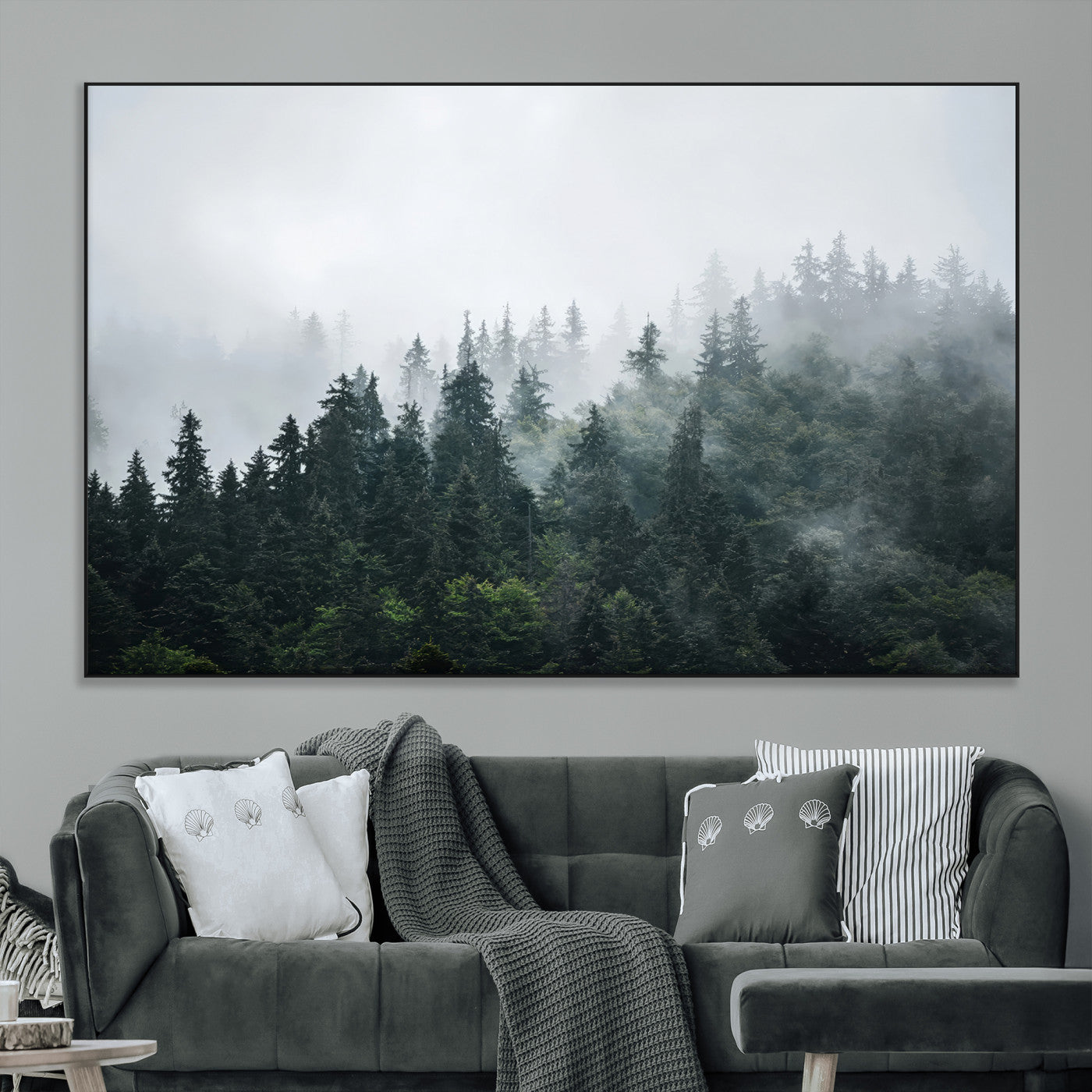 A misty evergreen forest shrouded in soft fog, creating a tranquil and moody landscape with lush green trees fading into the distance.