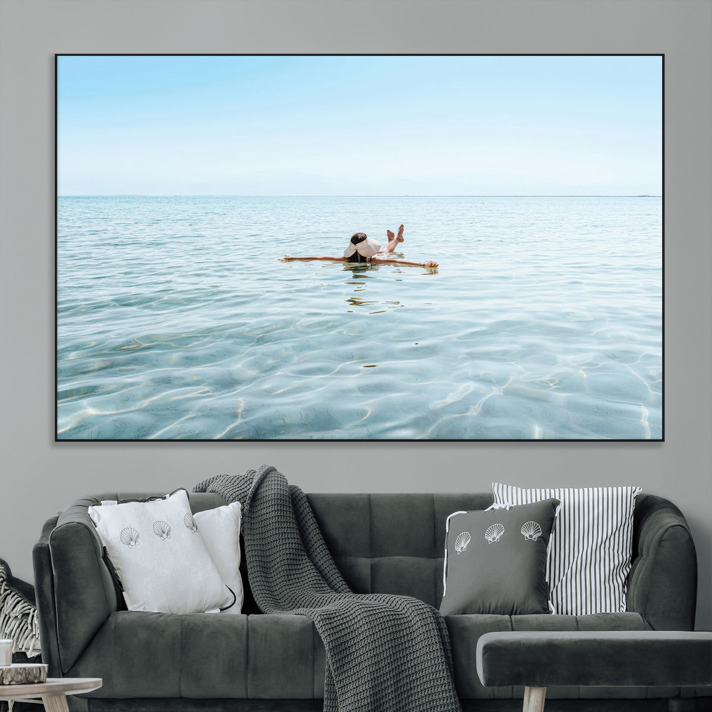 A peaceful minimalist scene of a person floating on crystal-clear water, surrounded by a vast open horizon, capturing relaxation and serenity in a tranquil aquatic setting.
