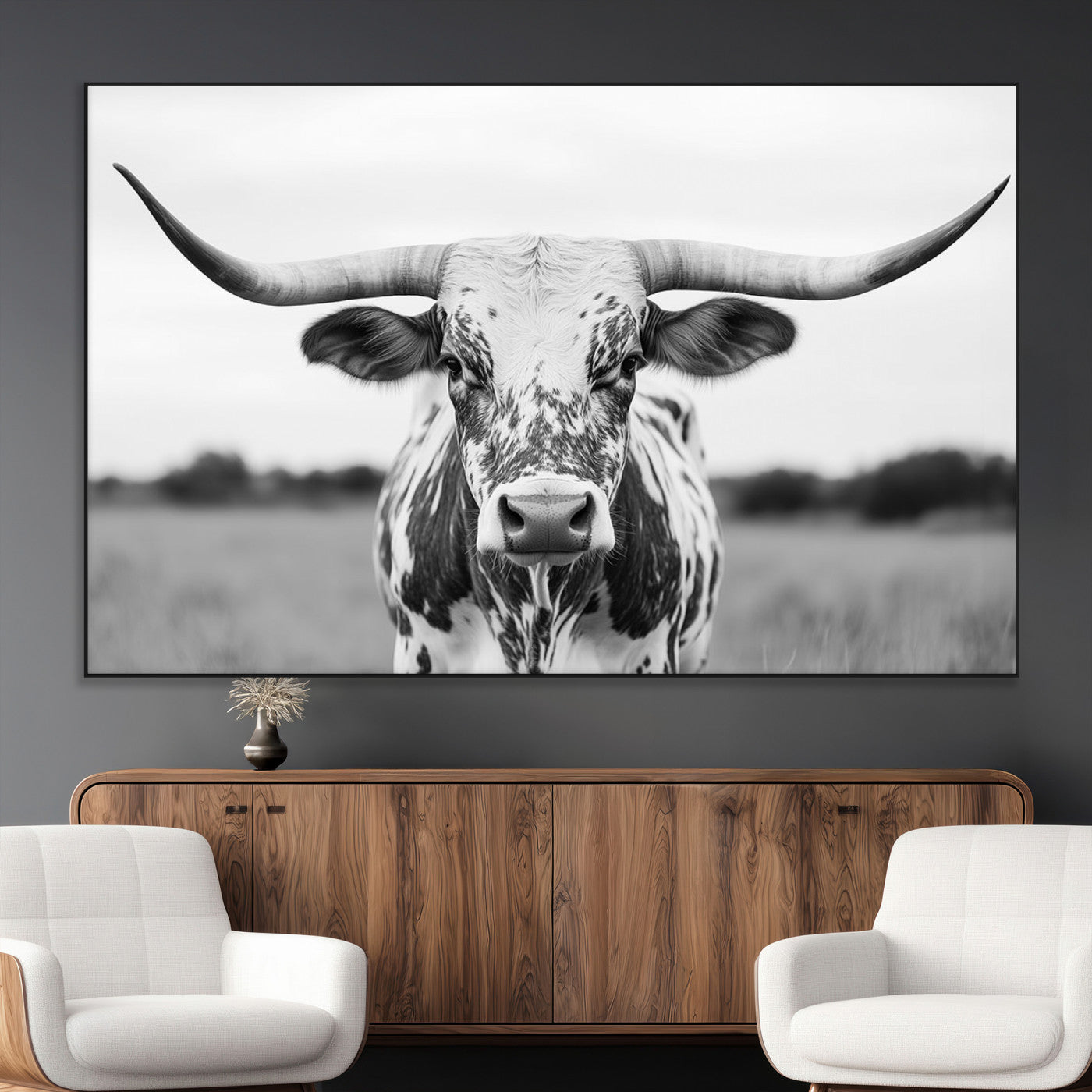 Capture the strength and elegance of nature with this striking black and white portrait of a longhorn cow. Its powerful presence makes a bold statement in any room.