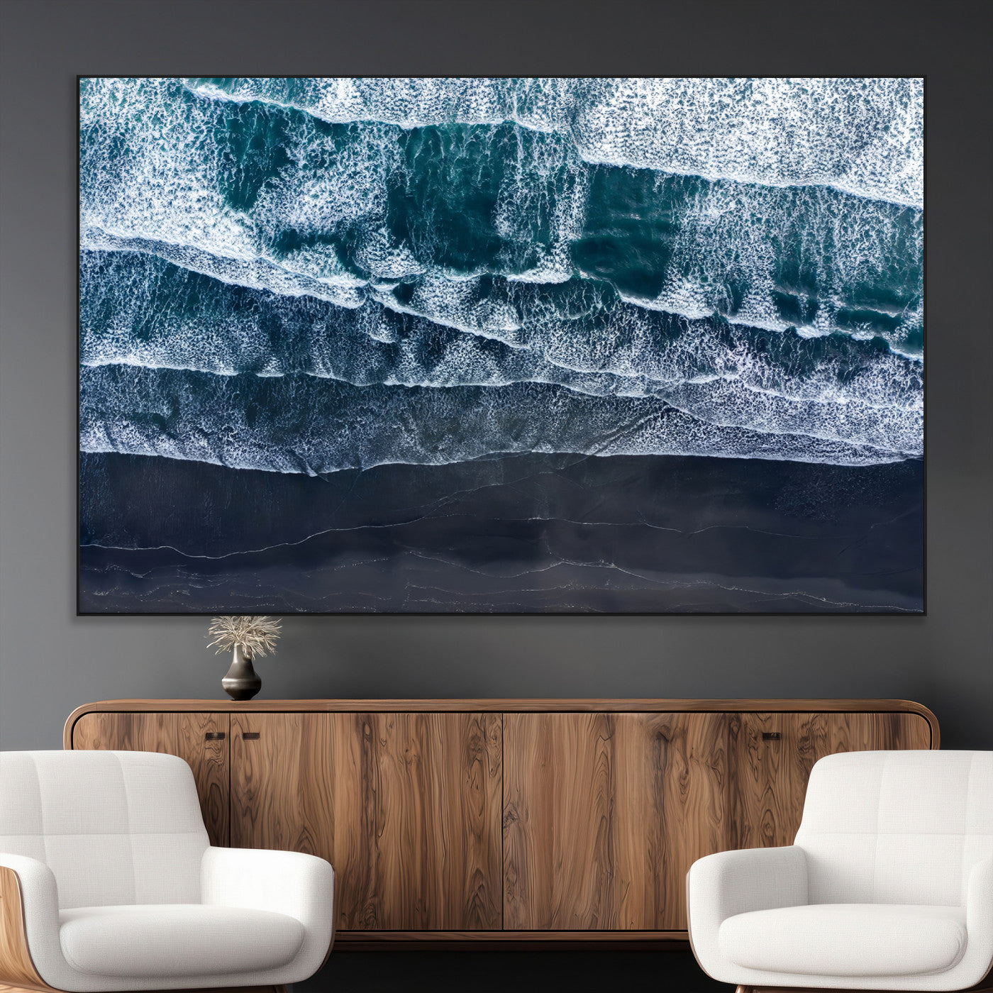 Canvas of aerial ocean waves crashing onto a black sand beach in moody tones, ideal for modern coastal or minimalist home decor.