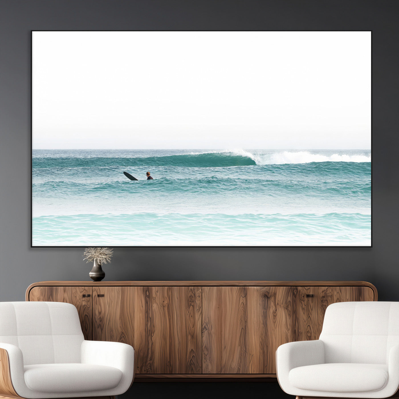 Minimalist photo of a lone surfer on calm aqua waves under bright sky, perfect for Scandinavian coastal or serene ocean-inspired home decor.