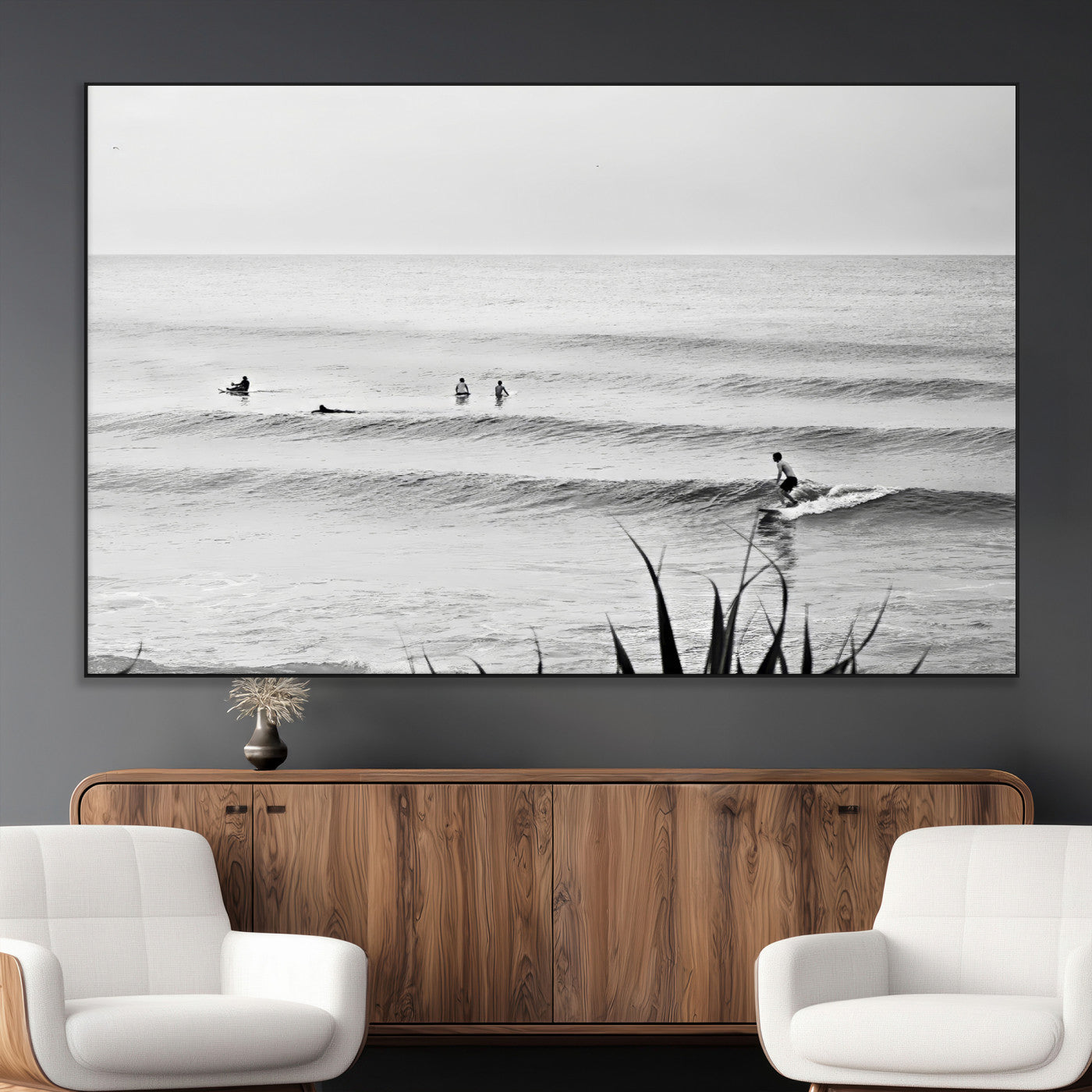 Monochrome canvas of surfers on calm ocean waves, ideal for minimalist coastal or beach-inspired interior decor.