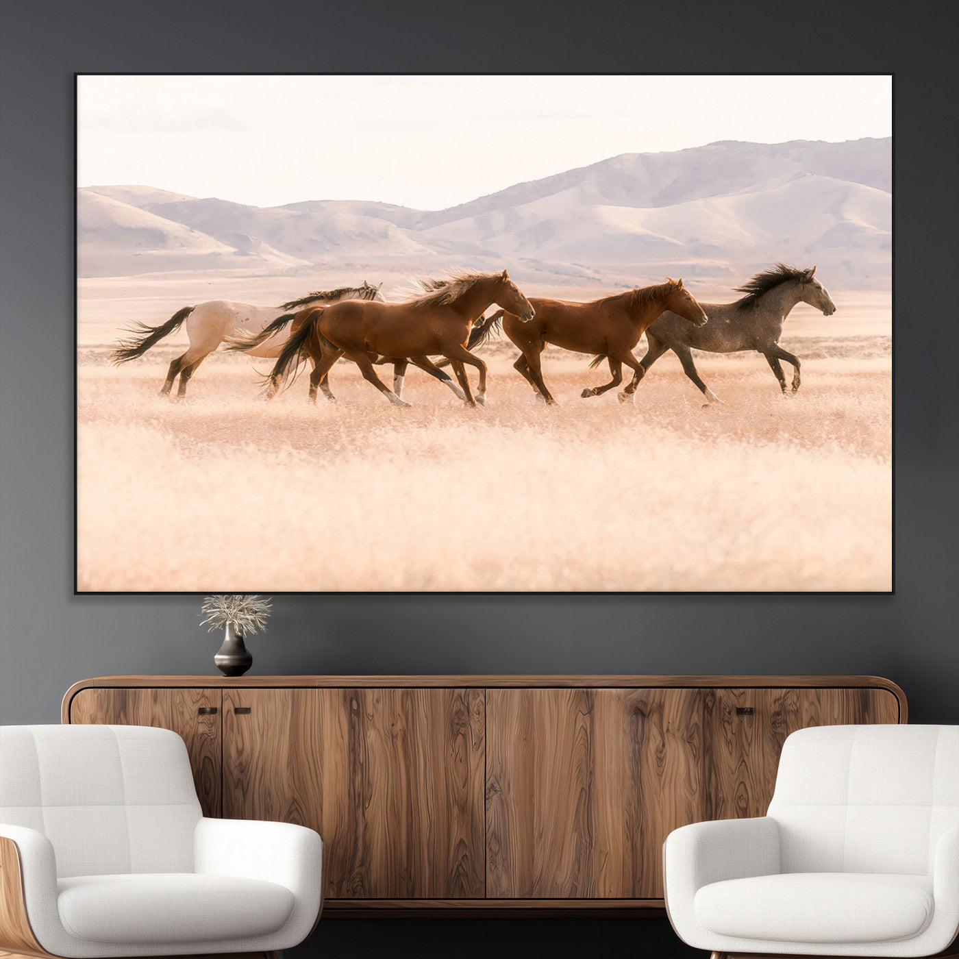 A herd of wild horses galloping through a sunlit desert plain with mountains in the background, perfect for rustic or western-themed wall decor.