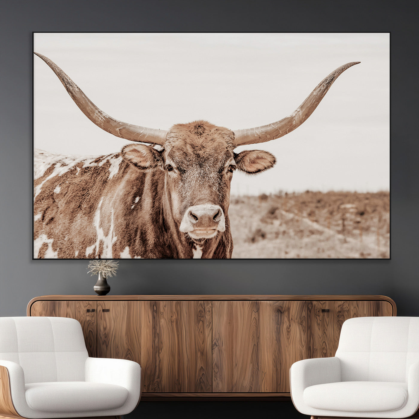 A longhorn cow in soft beige desert tones, standing calmly in open land, perfect for neutral western or rustic farmhouse interiors.