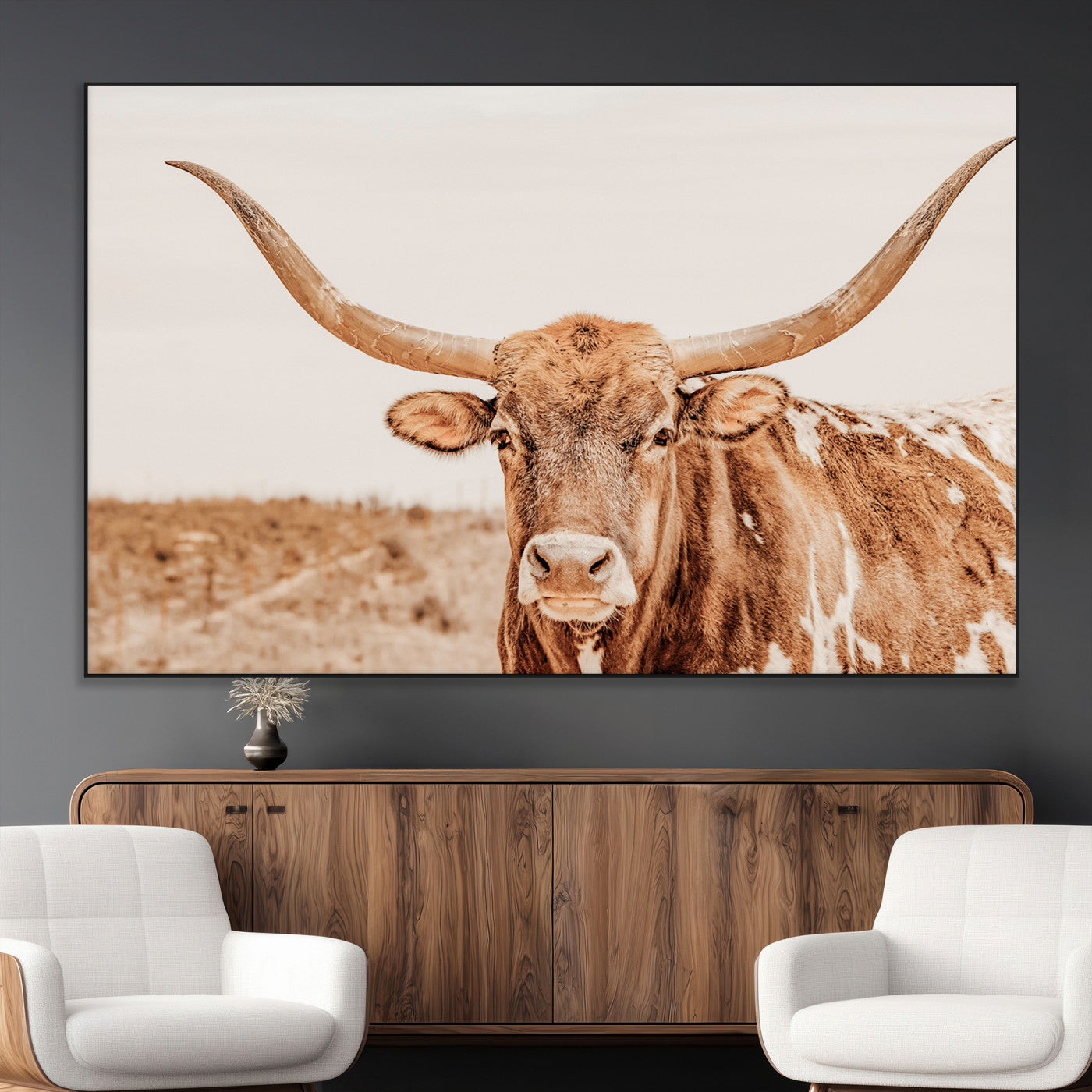 A longhorn bull standing proudly in a sunlit desert field with warm neutral tones, ideal for rustic western or farmhouse interiors.