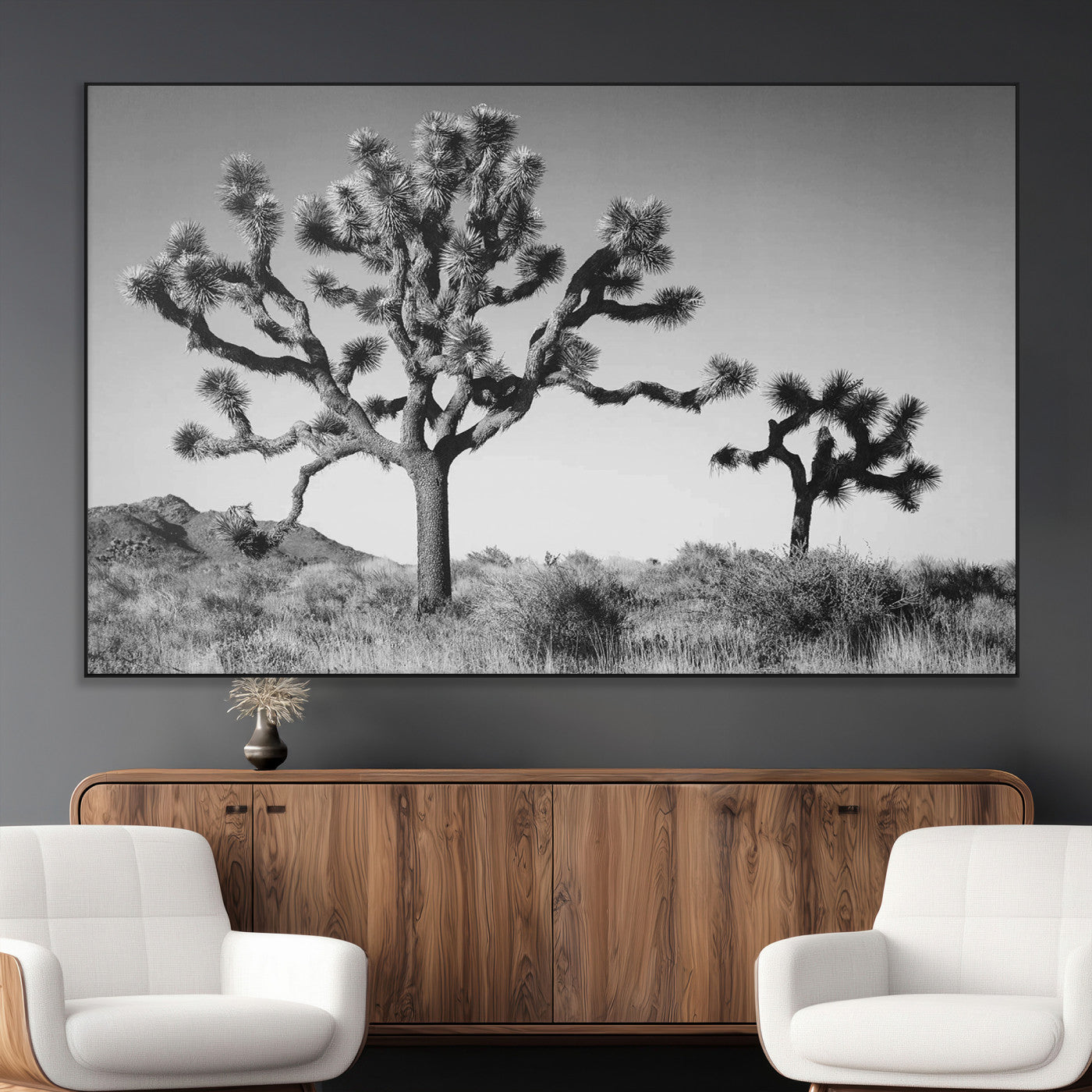 Black and white Joshua trees in a rugged desert landscape, creating a calm and minimalist feel for natural or rustic-themed interiors.