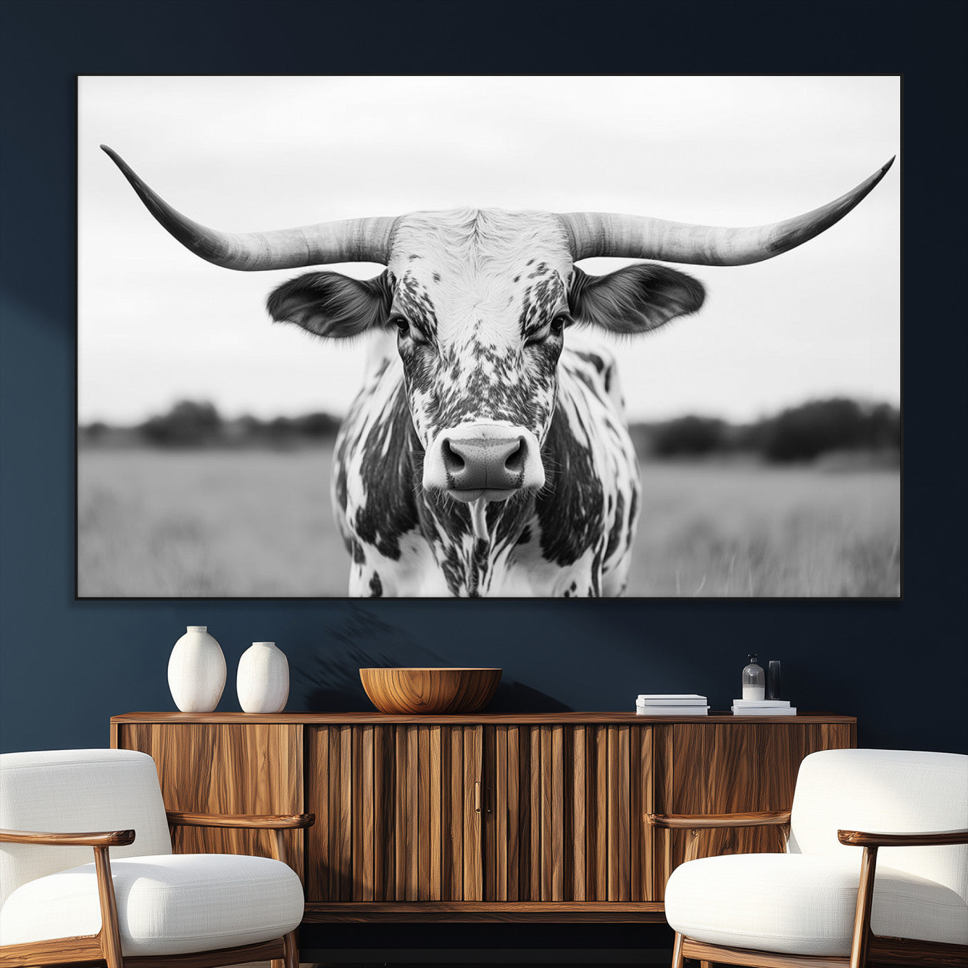 Capture the strength and elegance of nature with this striking black and white portrait of a longhorn cow. Its powerful presence makes a bold statement in any room.