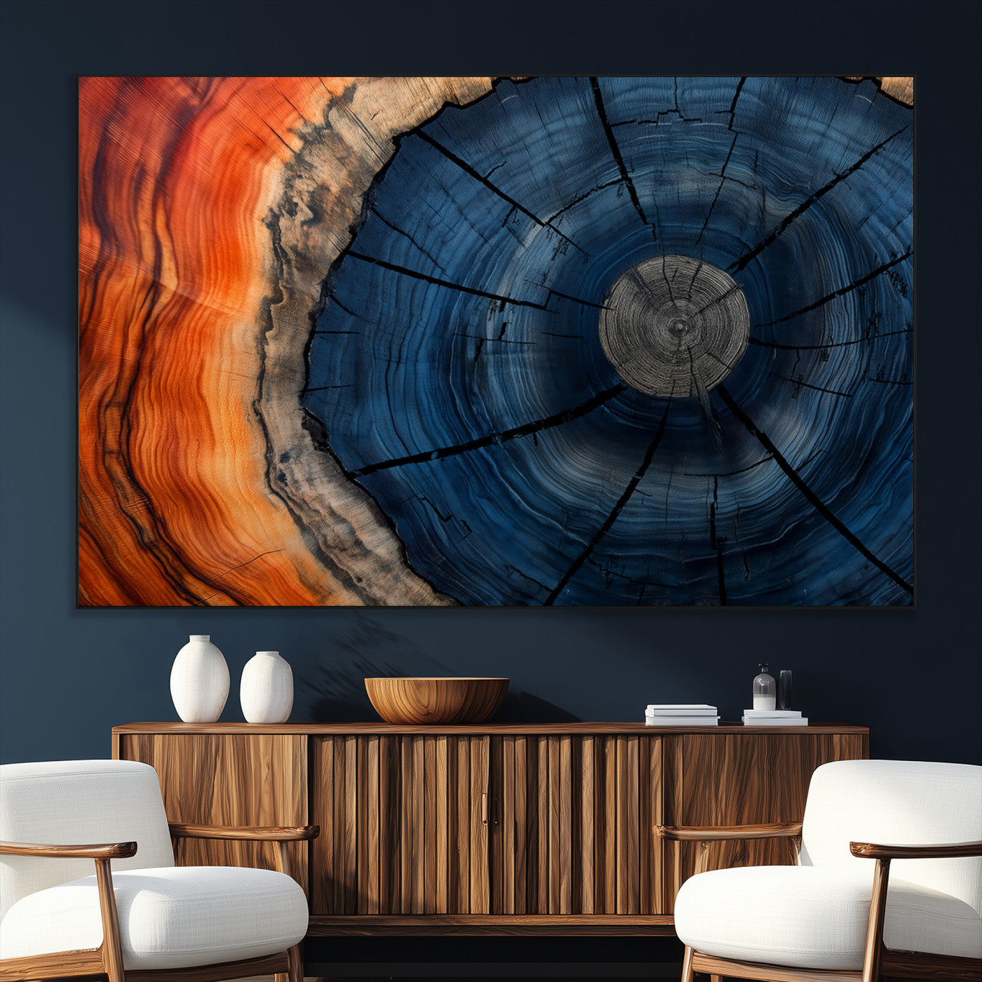 A captivating close-up of a tree trunk, showcasing its concentric rings in rich shades of blue, orange, and brown, highlighting the organic patterns of natural wood.
