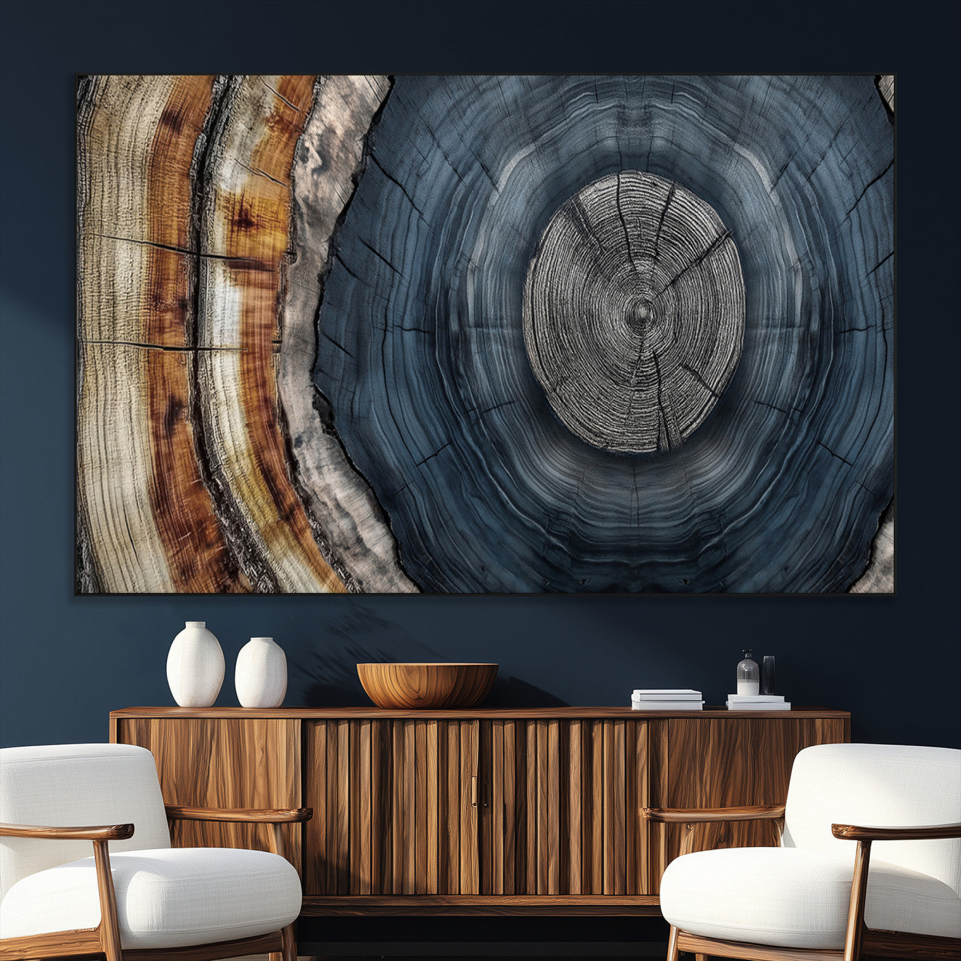 A stunning close-up of a tree trunk showing the intricate, circular growth rings, showcasing the natural textures and rich contrasts in deep blues, browns, and silvers.