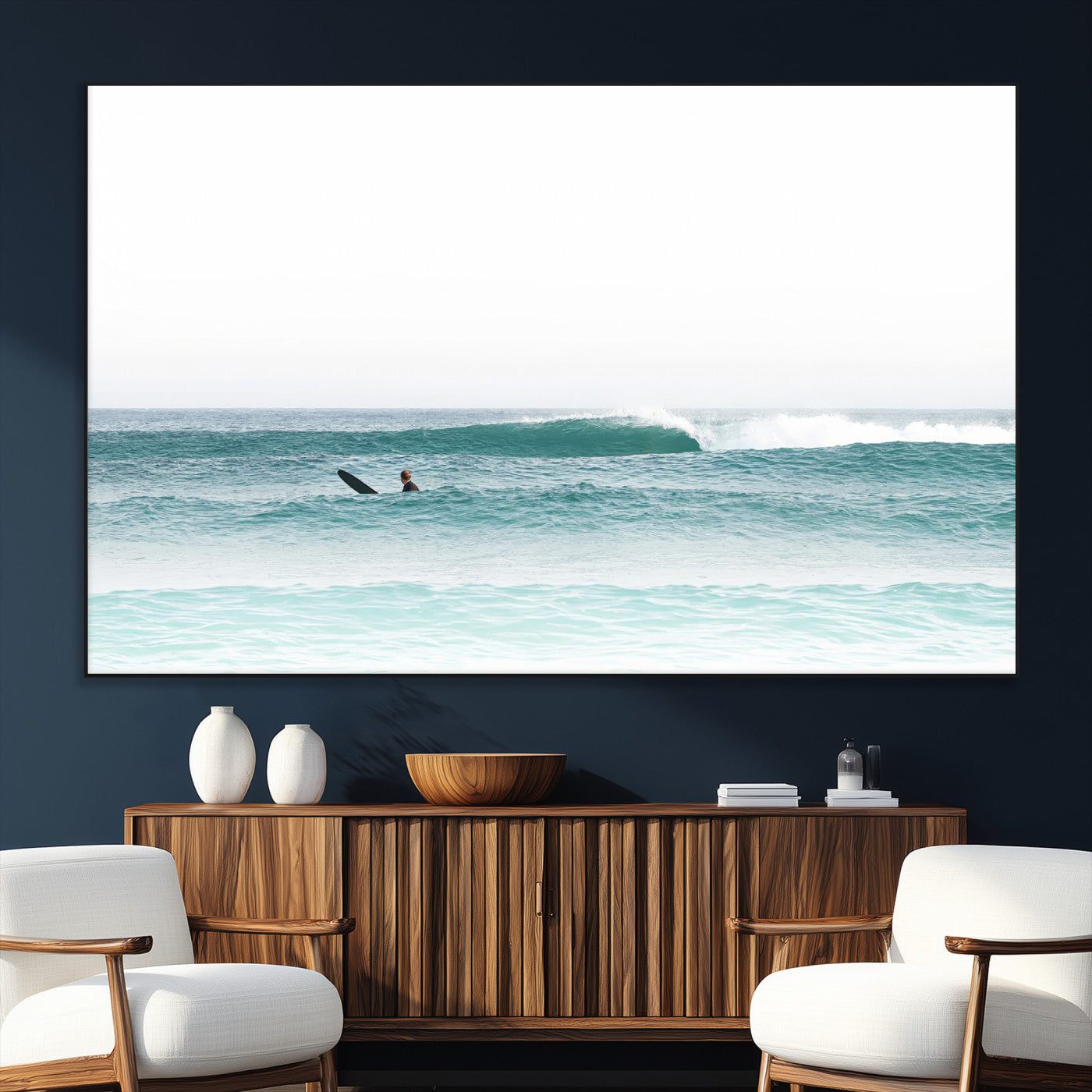 Minimalist photo of a lone surfer on calm aqua waves under bright sky, perfect for Scandinavian coastal or serene ocean-inspired home decor.