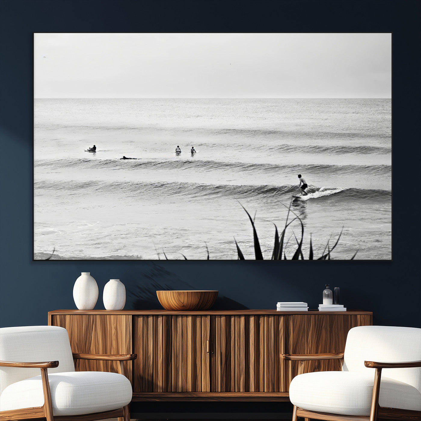 Monochrome canvas of surfers on calm ocean waves, ideal for minimalist coastal or beach-inspired interior decor.