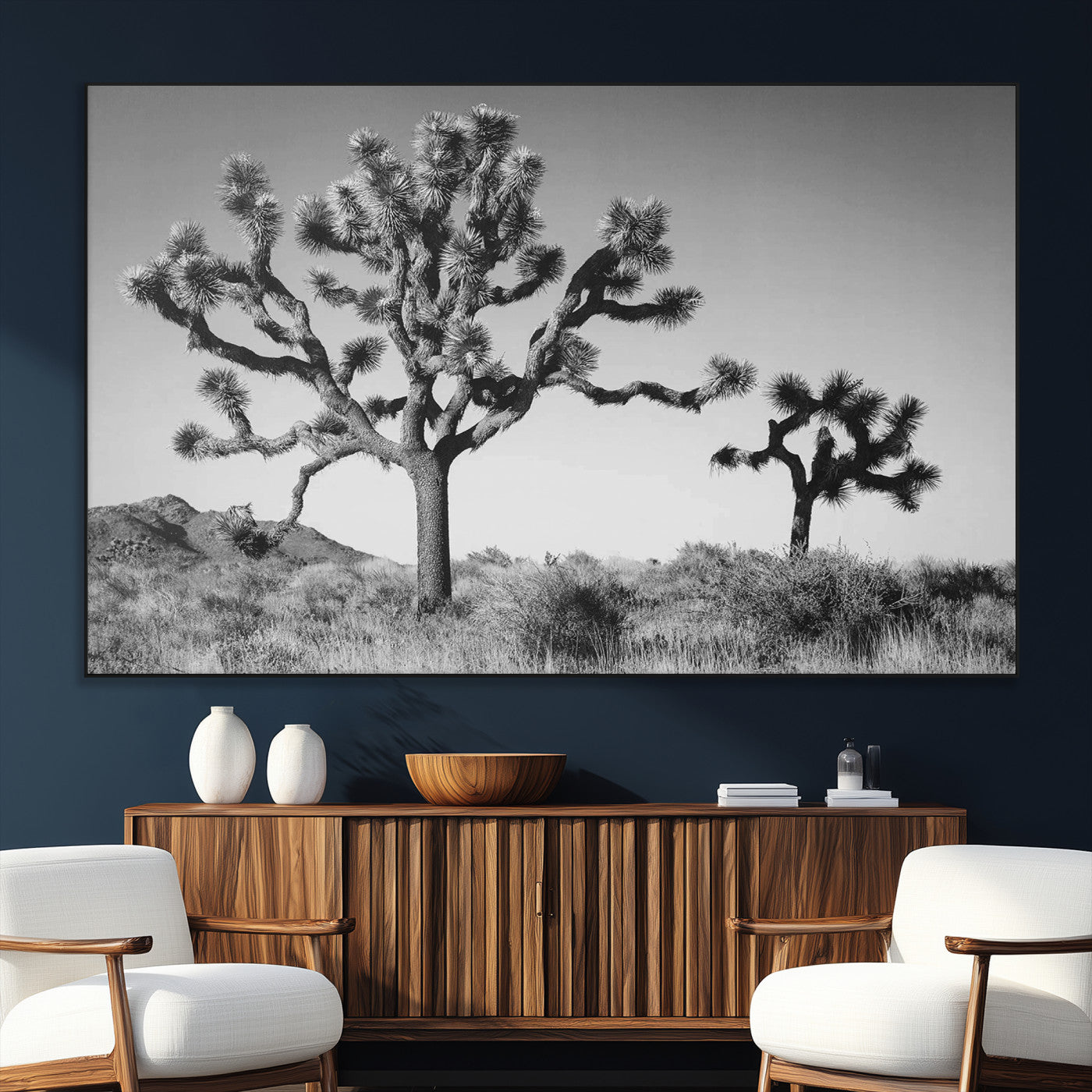 Black and white Joshua trees in a rugged desert landscape, creating a calm and minimalist feel for natural or rustic-themed interiors.